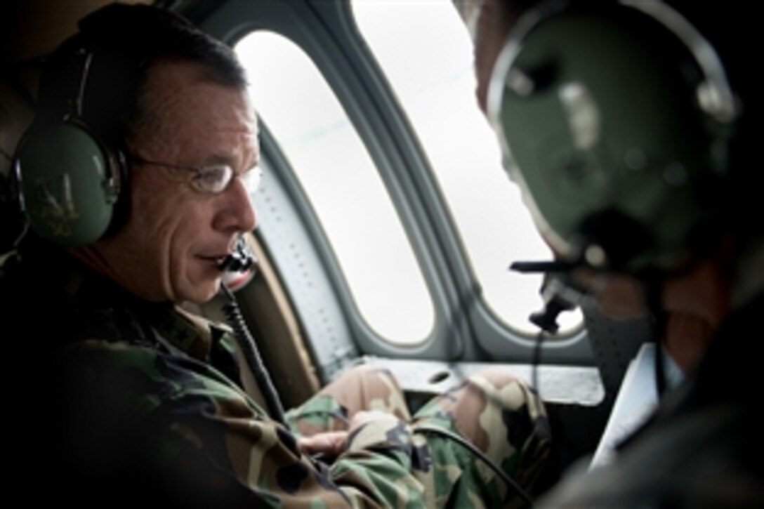 U.S. Navy Adm. Mike Mullen, chairman of the Joint Chiefs of Staff, receives an aerial tour of Fort Lewis and McChord Air Force Base, Wash., from U.S. Army Lt. Gen. Charles H. Jacoby, Jr., commanding general, I Corps, June 18, 2008.  