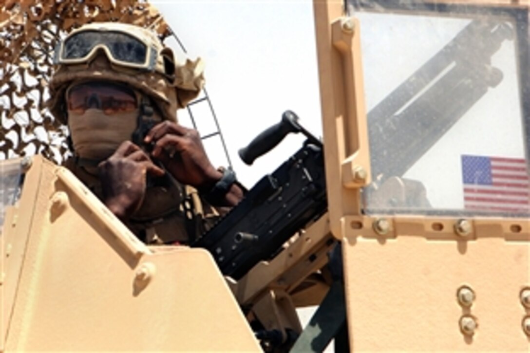 U.S. Marine Lance Cpl. Jordan Xavier prepares to head out on a mounted security patrol outside Al Asad Air Base, June 11, 2008. Xavier, a heavy equipment operator, is assigned to Bravo Company, Marine Wing Support Squadron 274, 3rd Marine Aircraft Wing Forward. 