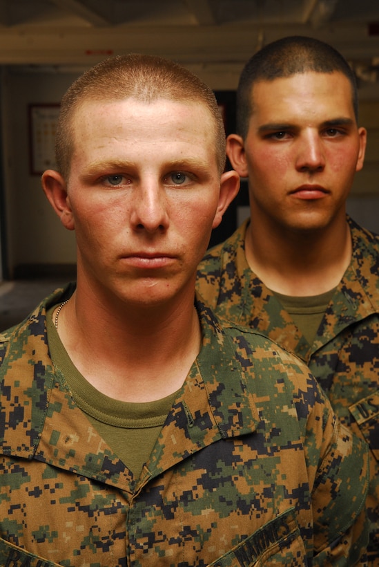 Pfc. Curtis, left, and Lance Cpl. Jonathon Bailey, Platoon 1042, Company C, joined the Marine Corps as brothers on the Buddy Program. Curtis held the position as the second squad leader while Jonathon was the platoon guide. Staff Sgt. Timothy L. Brown, senior drill instructor, Platoon 1042 said that their natural leadership abilities helped the platoon earn the title of honor platoon.