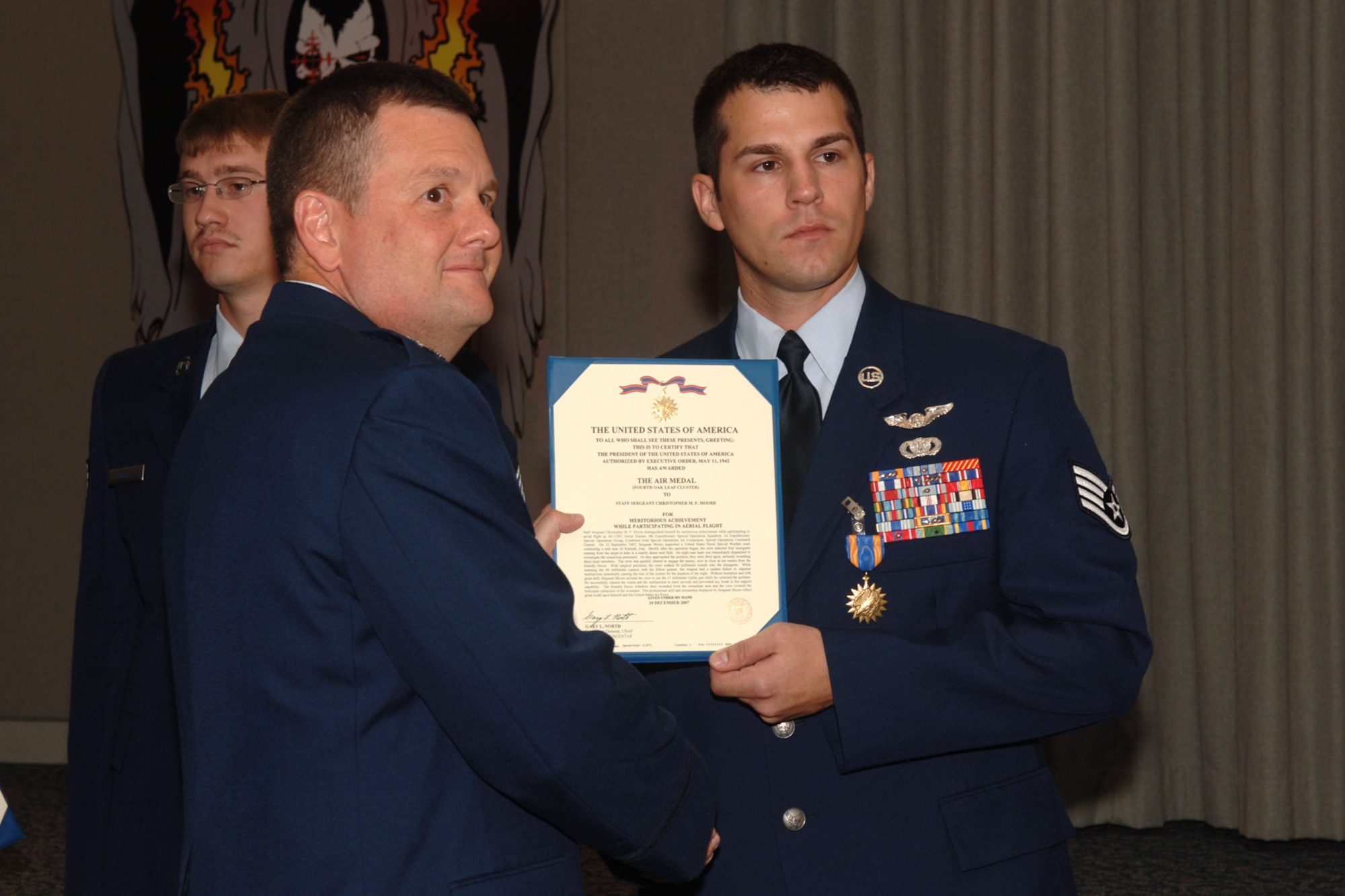 Staff Sgt. Christopher Moore  from the 4th Special Operations Squadron Hurlburt Field, Fla, is awarded the Single Mission Air Medal for extraordinary achievement while participating in aerial flight as an AC-130U crew, June 20, 2008. U.S. Air Force photo by SrA Emily Moore.
