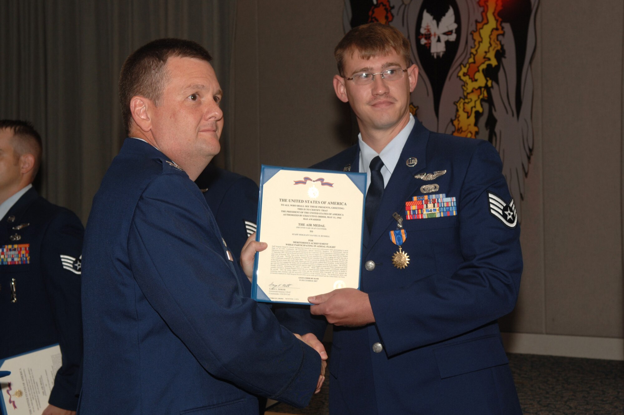 Staff Sgt. Daniel Russell  from the 4th Special Operations Squadron Hurlburt Field, Fla., is awarded the Single Mission Air Medal for extraordinary achievement while participating in aerial flight as an AC-130U crew, June 20, 2008. U.S. Air Force photo by SrA Emily Moore.