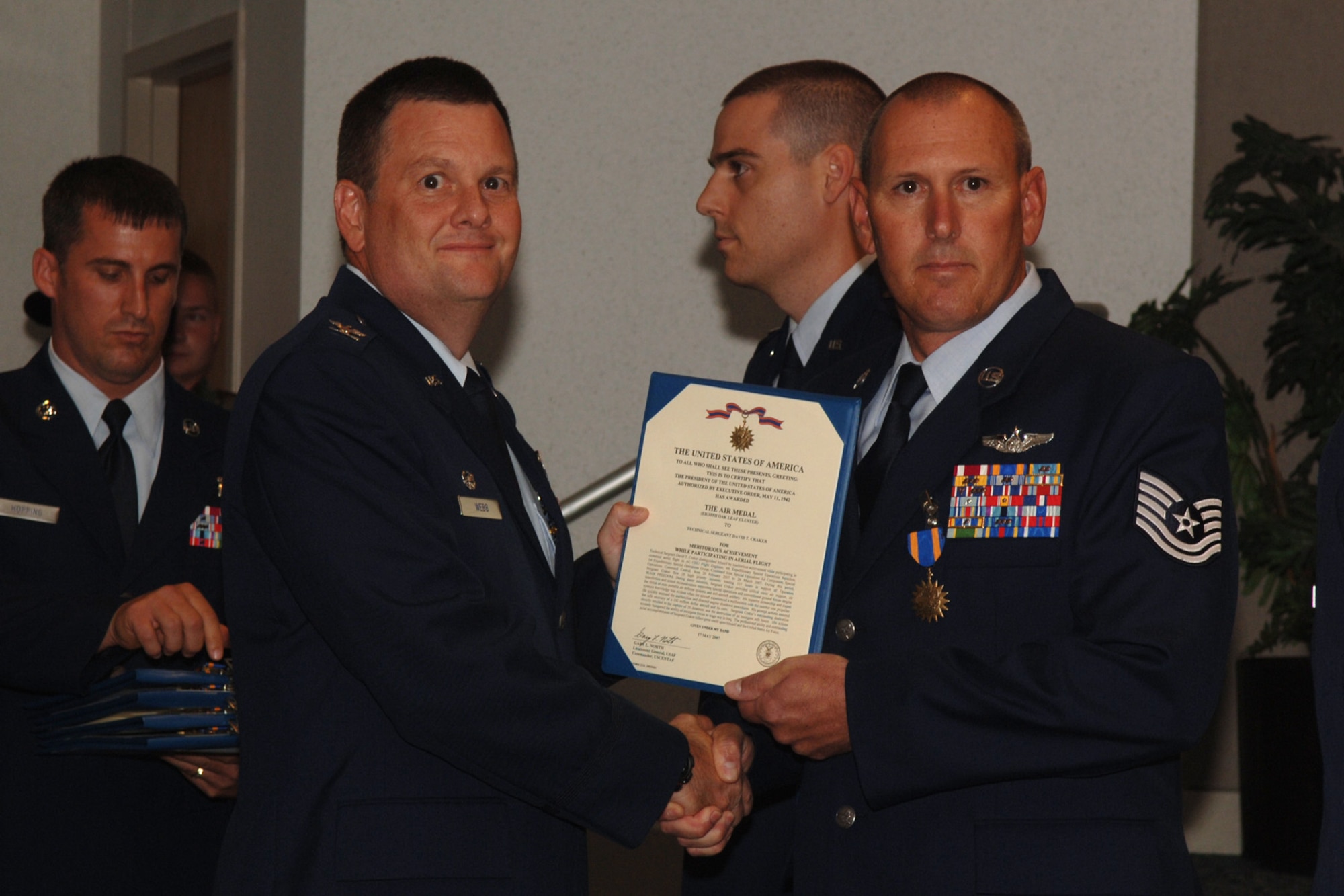 Tech Sgt. David Craker  from the 4th Special Operations Squadron Hurlburt Field Fla., is awarded the Single Mission Air Medal for extraordinary achievement while participating in aerial flight as an AC-130U crew, June 20, 2008. U.S. Air Force photo by SrA Emily Moore.