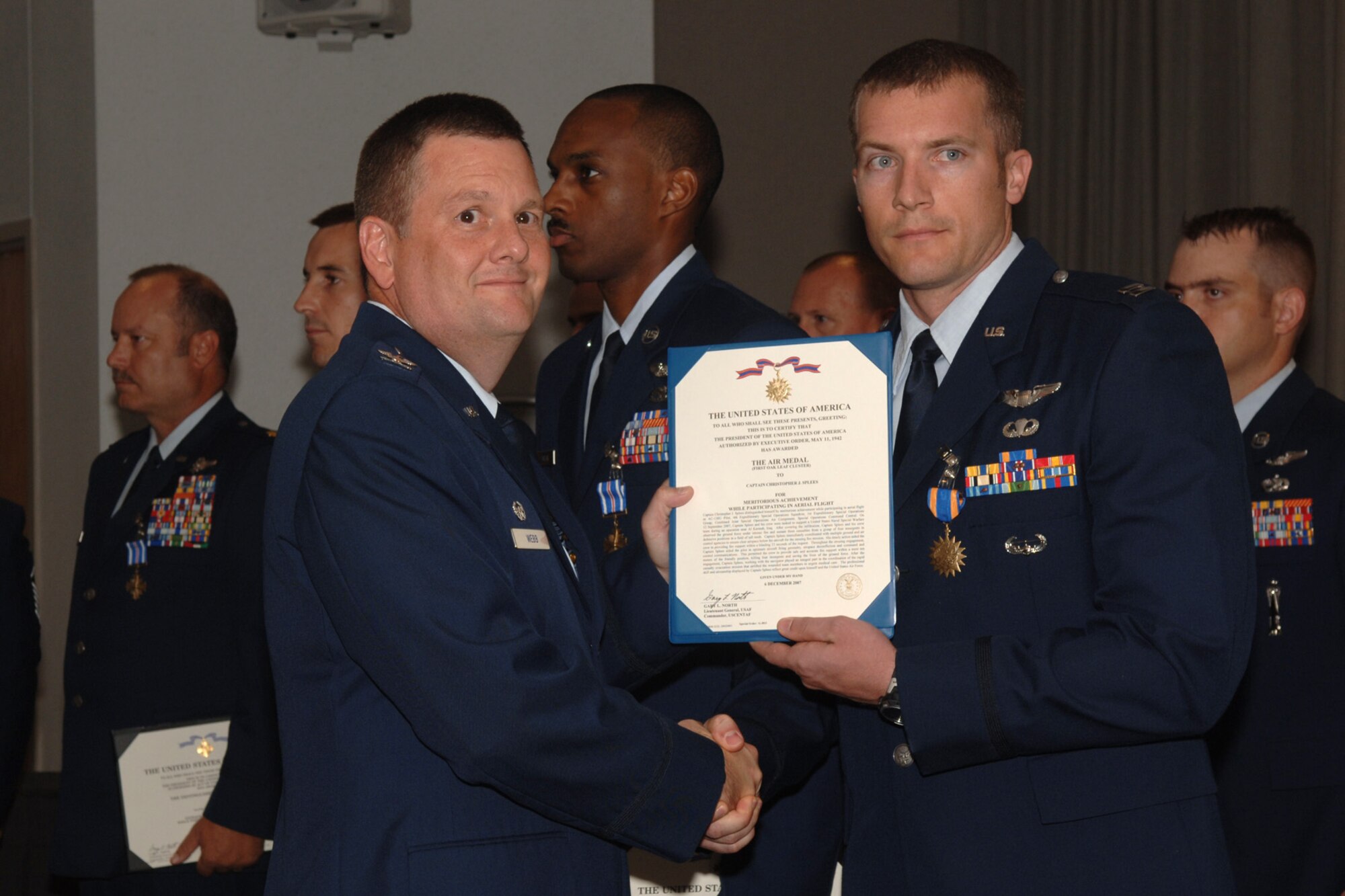 Capt Christopher Splees from the 4th Special Operations Squadron Hurlburt Field, Fla., is awarded the Single Mission Air Medal for extraordinary achievement while participating in aerial flight as an AC-130U crew, June 20, 2008. U.S. Air Force Emily Moore.