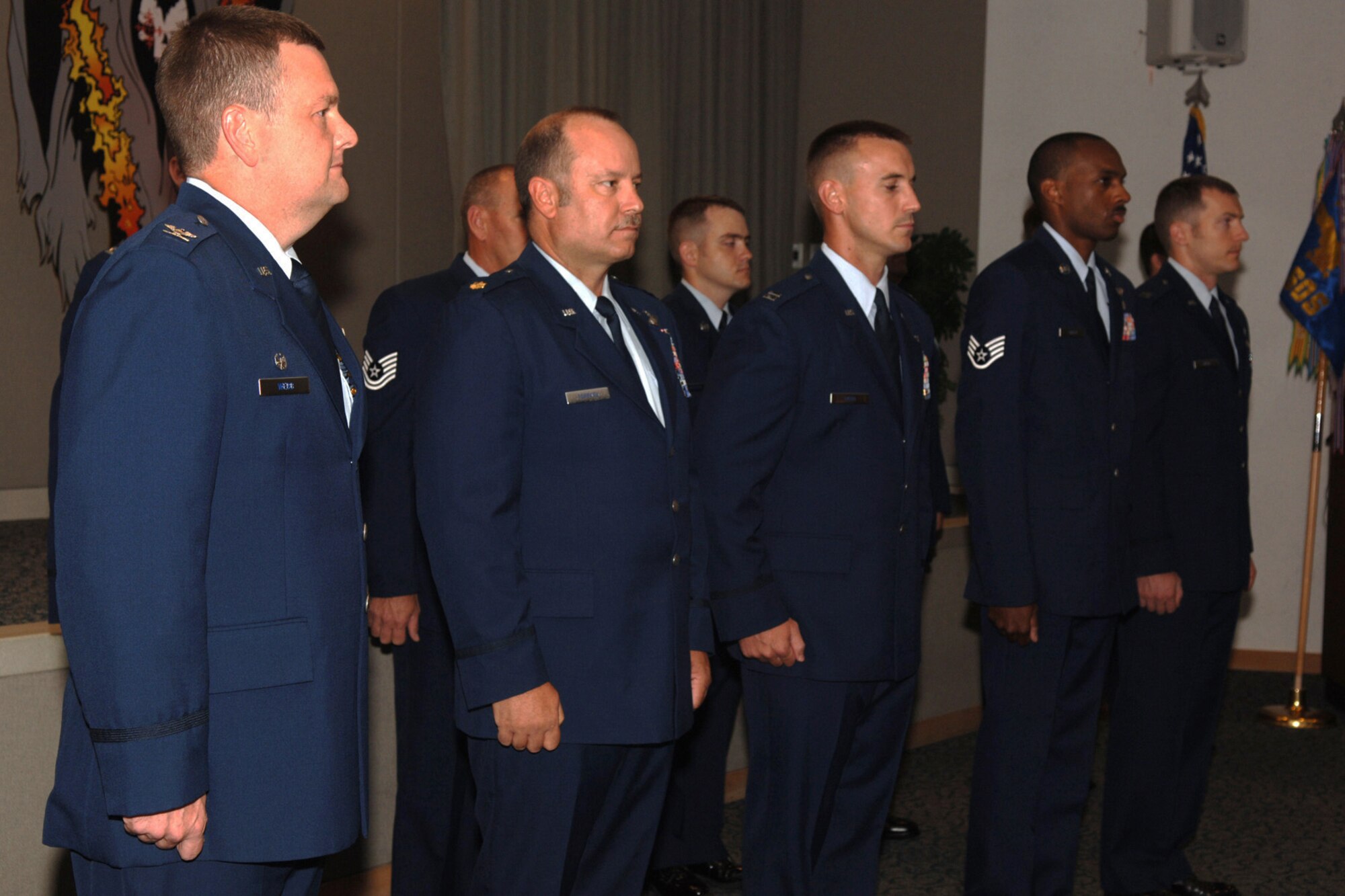 Aircrew members from the 4th Special Operations Squadron Hurlburt Field Florida, stand in formation before being awarded the Distinguished Flying Cross and Single Mission Air Medal for extraordinary achievement while participating in aerial flight as an AC-130U crew, June 20, 2008. U.S. Air Force photo by SrA Emily Moore