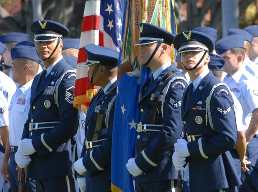 HICKAM AIR FORCE BASE, Hawaii -- Hickam Air Force Base Honor Guard stands at ease as they await the beginning of the change of command ceremony. The Honor Guard posted the colors for the ceremony. (U.S. Air Force Photo/Tyler Hatfield) 
