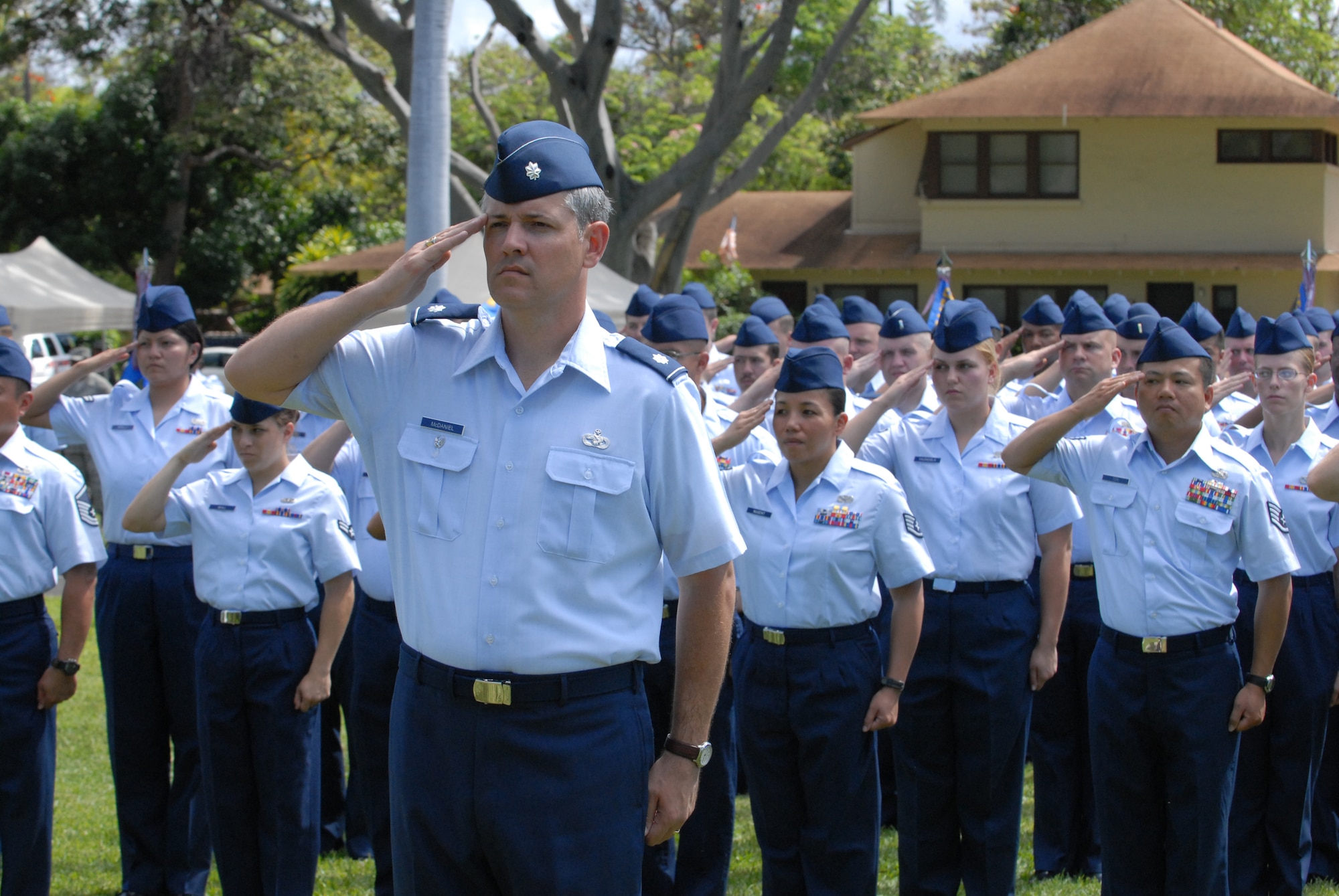 Lt. Col. Michael McDaniel, 15th Mission Support Group commander, and Airmen from the 15th Mission Support group represent the 15th Airlift Wing in formation at the Ceremony. Formations of Airmen from the 15th Airlift Wing's Medical, Operations, Maintenance and Mission Support groups represented Team Hickam at the change of command ceremony. (U.S. Air Force Photo/Tyler Hatfield)