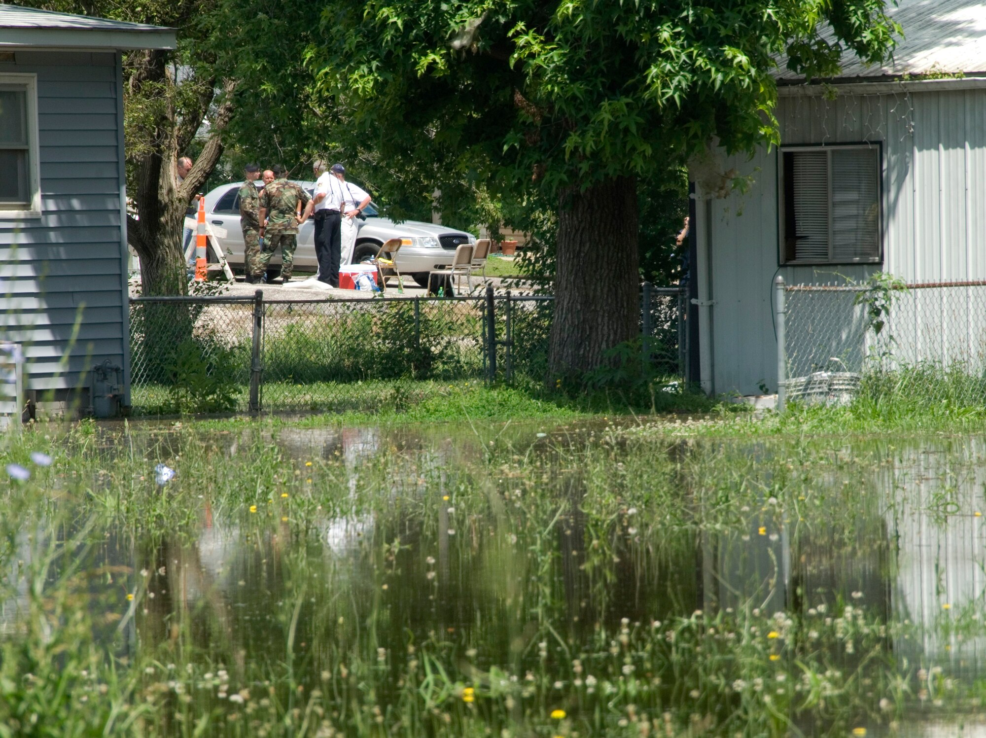 Checkpoints manned by members of the Missouri Air National Guard June 20, are set up along a 30-mile stretch of the Mississippi River near Winfield, Mo. Air National guardsmen control access to flooded areas provide a deterrent to would-be looters. (U.S. Air Force photo/Master Sgt. Jack Braden)