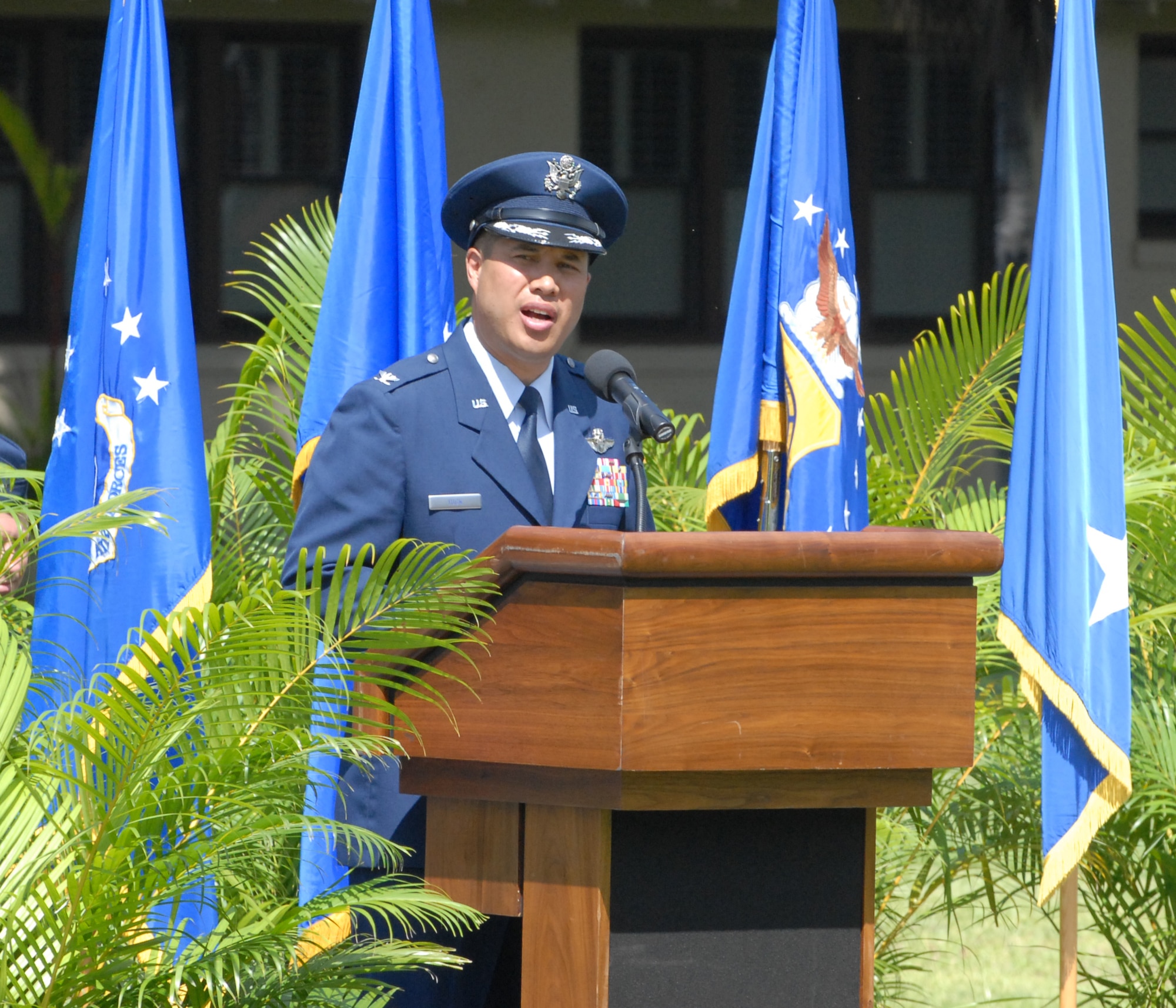 Col. Giovanni K. Tuck, 15th Airlift Wing commander, gives his first remarks to the men and women of the 15th Airlift Wing upon assuming command during a June 20 ceremony at the Freedom Tower Mall. (U.S. Air Force Photo/Tyler Hatfield)