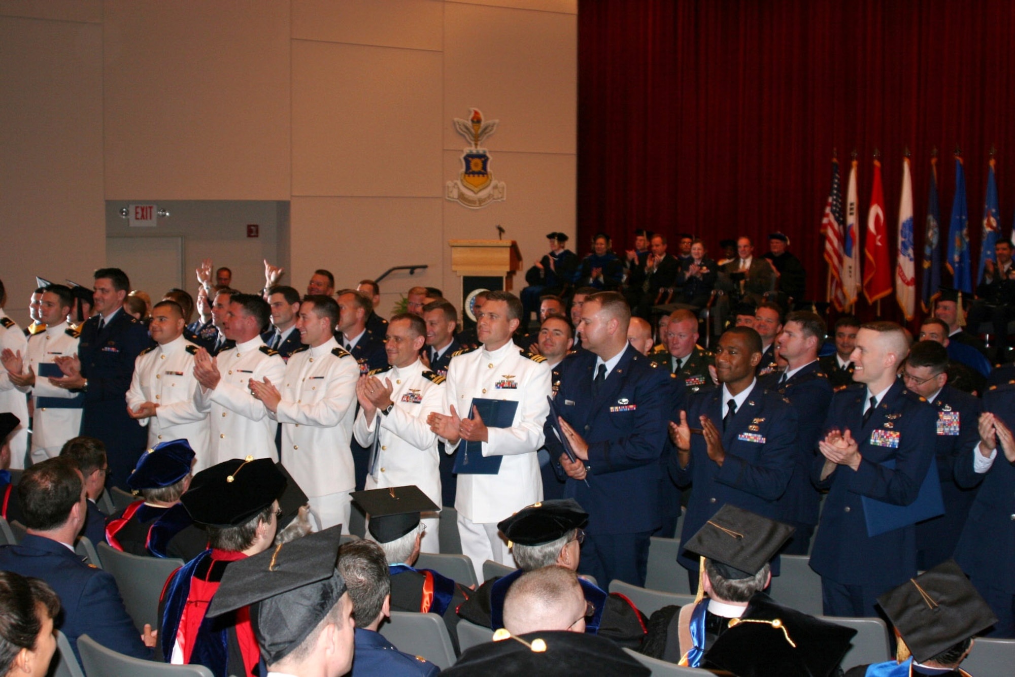 The members of the Air Force Institute of Technology's 2008 graduating class thank their family, friends and faculty members for support.  Seventy two students were graduated during a ceremony June 19.  (U.S. Air Force photo)
