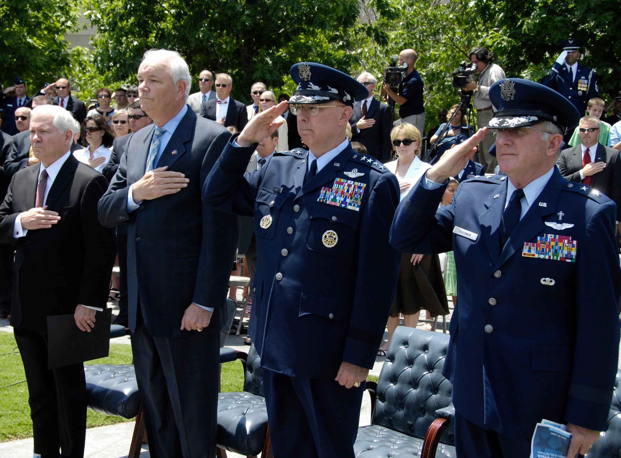 The official party pays honors during the National Anthem during a farewell ceremony in honor of Michael W. Wynne, Secretary of the Air Force at the U.S. Air Force Memorial, Arlington, Va., June 20. From left to right are  Defense Secretary Robert M. Gates, Air Force Secretary Wynne, Air Force Chief of Staff T. Michael Moseley and recently retired Air Force Chief of Chaplains Maj. Gen. Charles Baldwin. Secretary Wynne is the Air Force's 21st secretary. (U.S. Air Force photo/Ms. Donna Parry)