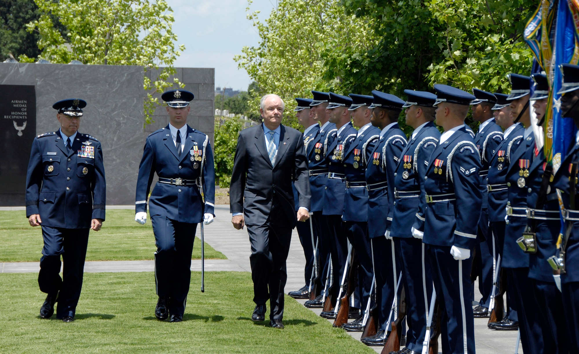 The official party walks through a pass-and-review during the farewell ceremony in honor of Michael W. Wynne, Secretary of the Air Force at the U.S. Air Force Memorial, Arlington, Va., June 20. From left to right are Air Force Chief of Staff T. Michael Moseley, Capt. Brent Mundie, the commander of troops from the U.S. Honor Guard and Air Force Secretary Wynne. Secretary Wynne is the Air Force's 21st secretary. (U.S. Air Force photo/Ms. Donna Parry)