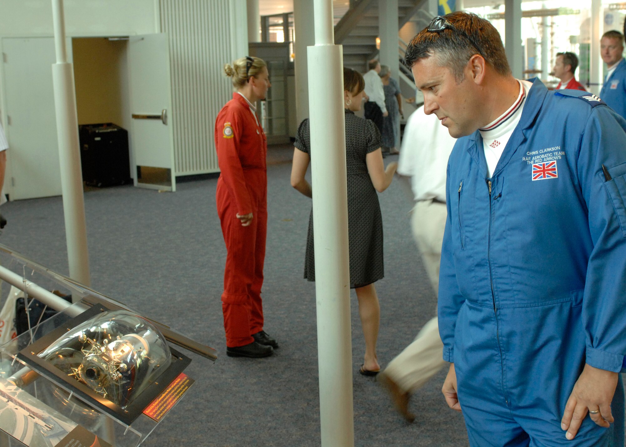 LANGLEY AIR FORCE BASE, Va. -- Chris Clarkson, British Royal Air Force Red Arrows mechanic, looks over the history of the Apollo 12 exhibit at the Virginia Air and Space Center June 20. The Red Arrows are to perform at AirPower over Hampton Roads. Langley’s annual open house is an event that helps educate the public, increase recruiting and show appreciation to the local community. (U.S. Air Force photo/Airman 1st Class Aaron Johnson) 