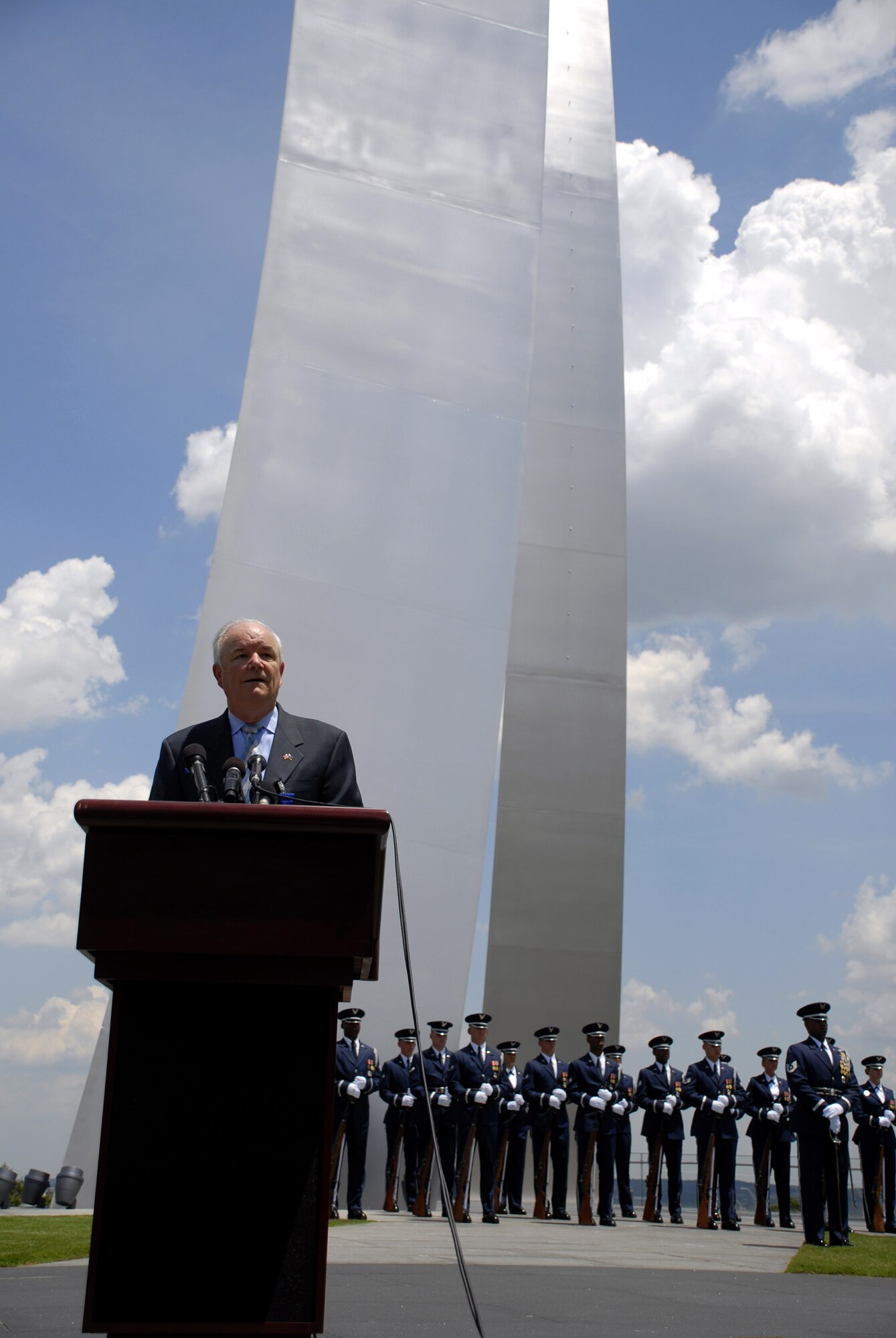 Secretary of the Air Force Michael W. Wynne salutes a crowd of Airmen at the Air Force Memorial June 20, his final day as their senior civilian official. Secretary Wynne was confirmed as the SECAF in November 2005. During his tenure as the secretary, he saw vast improvements to the Air Force, including adopting cyberspace as a warfighting domain, properly training Airmen to deploy for new roles and responsibilities, acquiring the weapon systems needed to sustain Air Force missions, as well as many others. (U.S. Air Force photo/Staff Sgt. J.G. Buzanowski)