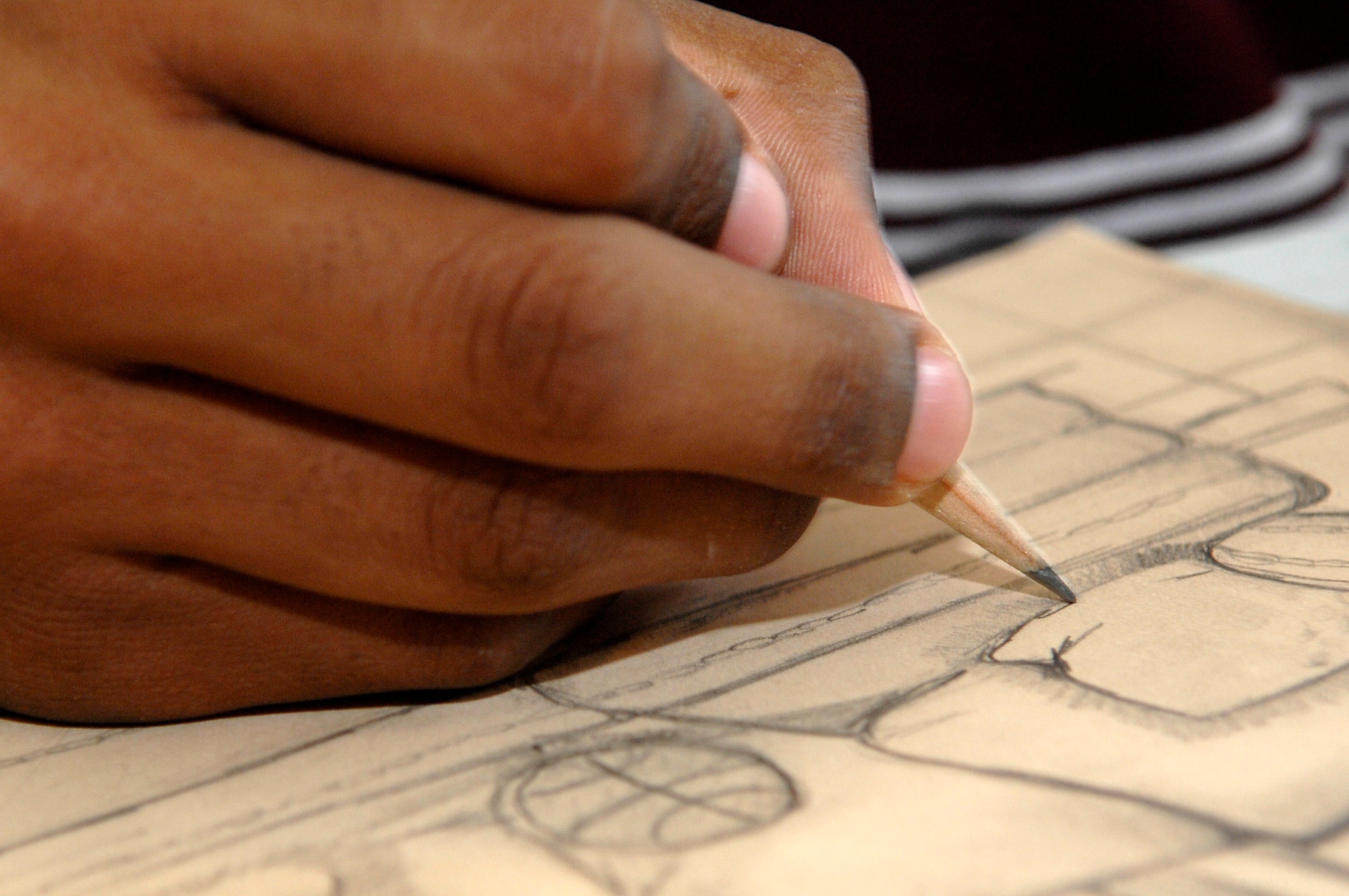 BARKSDALE AIR FORCE BASE, La. - Xavier, 13, son of Staff Sgt Donovan Pemberton draws a picture of his family's living room to pass time during his summer vacation June 19. Xavier earned the top middle school award at Art Break where he competed against all middle schools in Bossier and Caddo Parishes. (U.S. Air Force photo by Airman 1st Class Joanna M. Kresge)