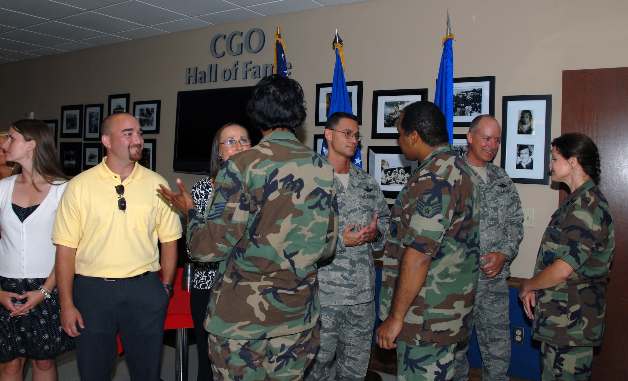 Col. Brett J. Clark, center, is welcomed by members of the 908th Airlift Wing during a reception following his change of command ceremony June 7 at Maxwell AFB, Ala.  The colonel is flanked by his mom, Collette, left, and his second in command, Col. Jon Andre, right.  The Montgomery, Ala.-based 908th AW is Alabama's only Air Force Reserve unit. 
(U.S. Air Force photo by Mr. Jeff Melvin)