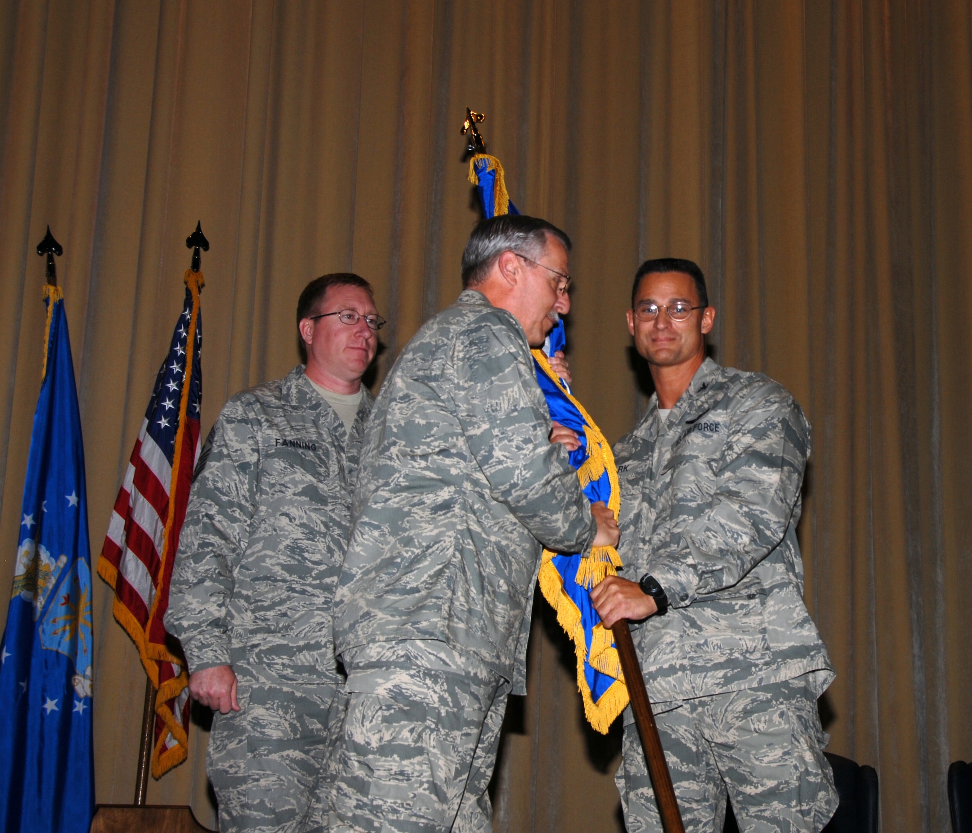 Col. Brett J. Clark, right, accepts the 908th Airlift Wing flag from Maj. Gen. Martin M. Mazick, signifying assumption of command responsibility for the Montgomery-based C-130 flying unit. As commander of Air Force Reserve Command?s 22nd Air Force, General Mazick oversees 10 C-130s unit across the nation. Colonel Clark's last duty position before coming to Maxwell was commander, 440th Operations Group, 440th Airlift Wing, Pope AFB, N.C.
(U.S. Air Force photo by Mr. Jeff Melvin)
