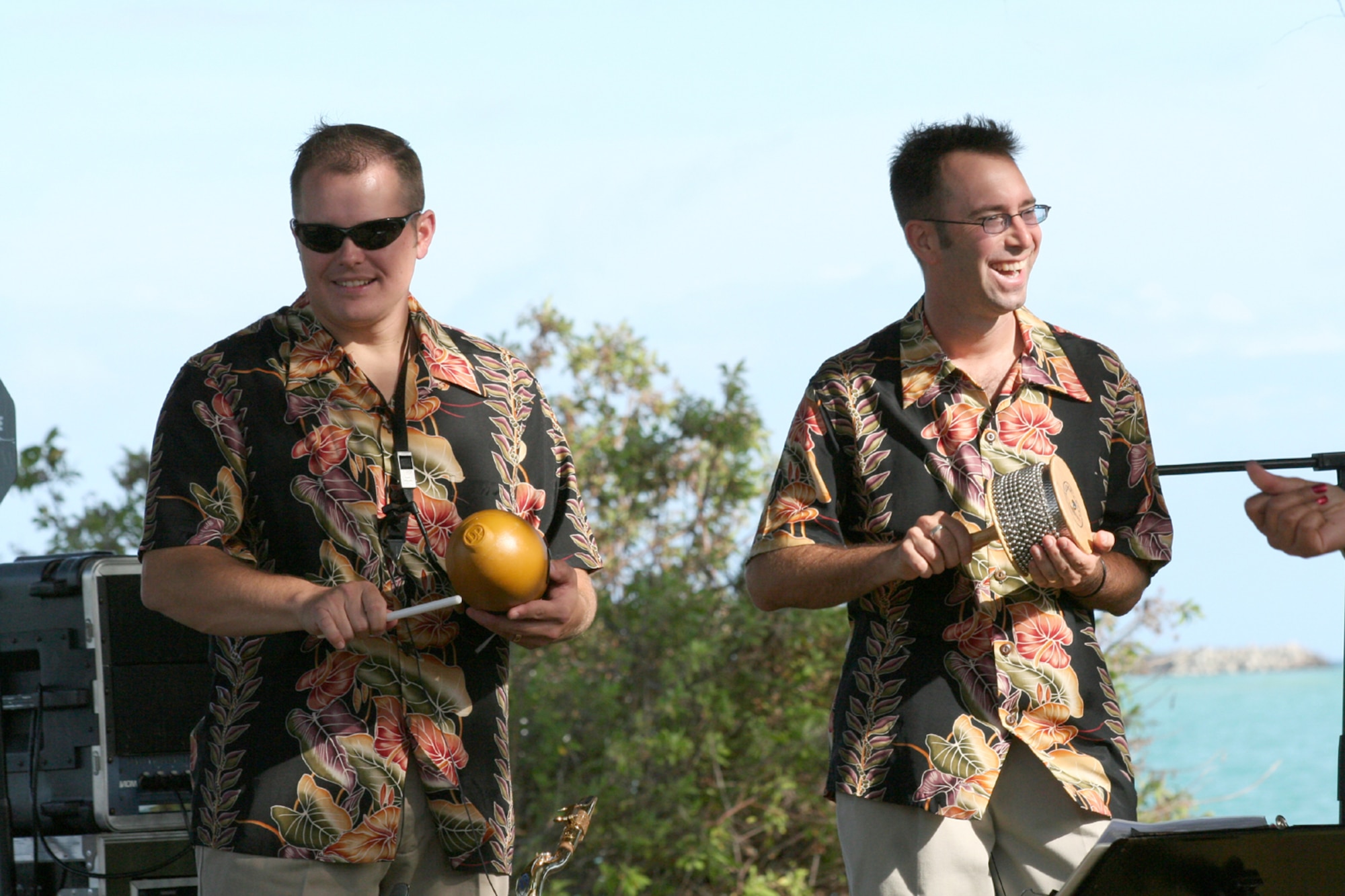 HICKAM AIR FORCE BASE, Hawaii – U.S. Air Force Staff Sergeant Gregory S. Lacy, guitarist, and Master Sergeant David C. Jenkins, trumpet, members of the Air Force Band of the Pacific, ‘Hana Hou’, perform here May 18 during a concert hosted by Col. J.J. Torres, 15th Airlift Wing commander.  Hana Hou’s performances delight military and civilian audiences throughout Hawaii and the Pacific.  (US Air Force photo/ Master Sgt. Cherie McNeill)  