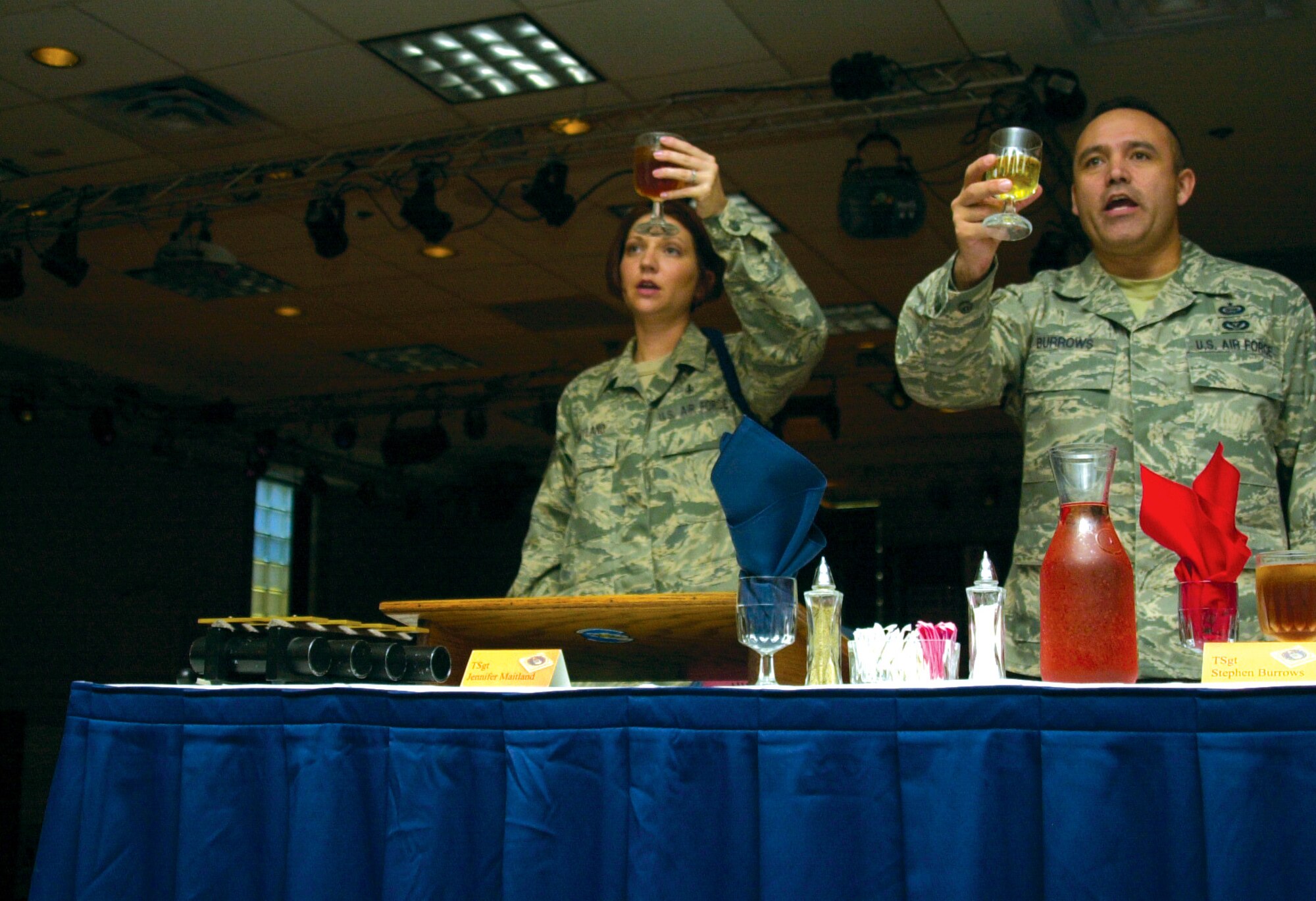 Technical Sergeant Jennifer Maitland, mess vice president, and Tech. Sgt. Stephen Burrows, the sergeant-at-arms, raise a toast “to the President of the United States!” at the 17th Training Wing Joint Enlisted Dining-In June 12. (U.S. Air Force photo by Senior Airman Stephen Musal)