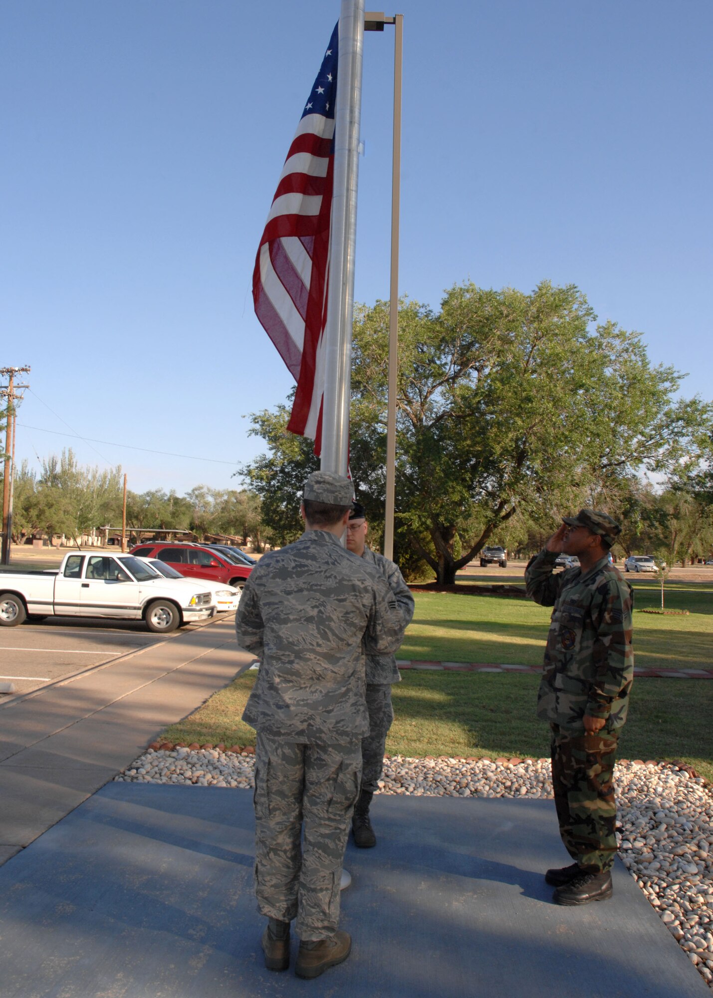 CANNON AIR FORCE BASE, N.M. -- Airmen currently in Airman Leadership School raise the flag during reveille June 20. The current class of future NCOs graduates July 10. (U.S. Air Force photo/Airman 1st Class Evelyn Chavez)