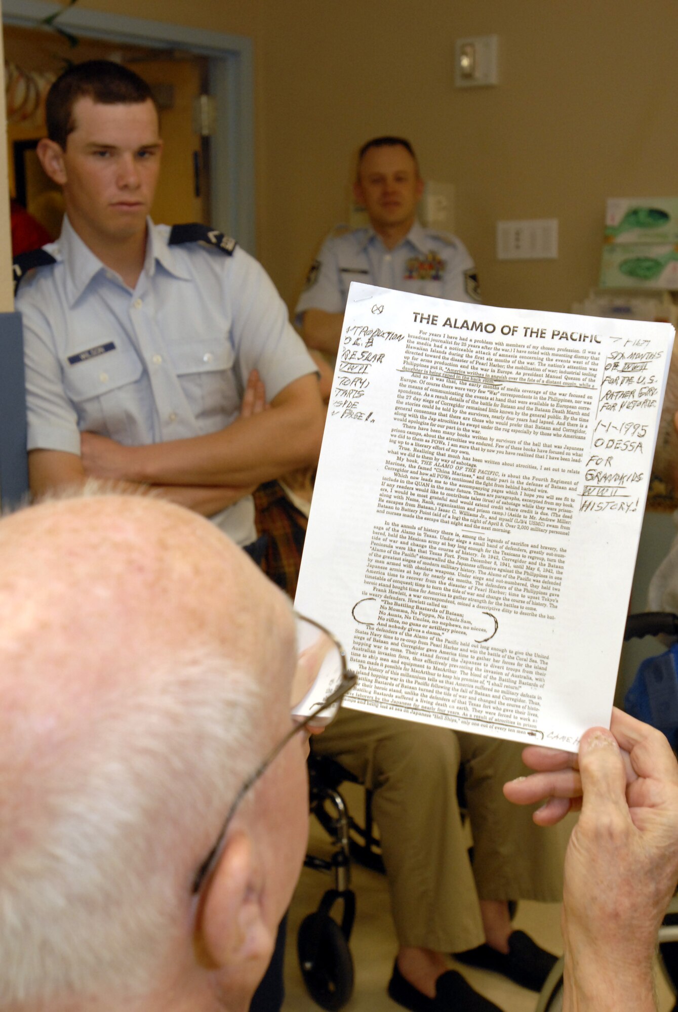 Mr. Lyndall Preslar, a former Marine, talks about his experiences as a prisoner of war during World War II as United States Air Force Academy Cadet Brain Wilson and Master Sgt. Philip Hudson listen to a bit of history June 16. (U.S. Air Force photo by Master Sgt. Randy Mallard)
