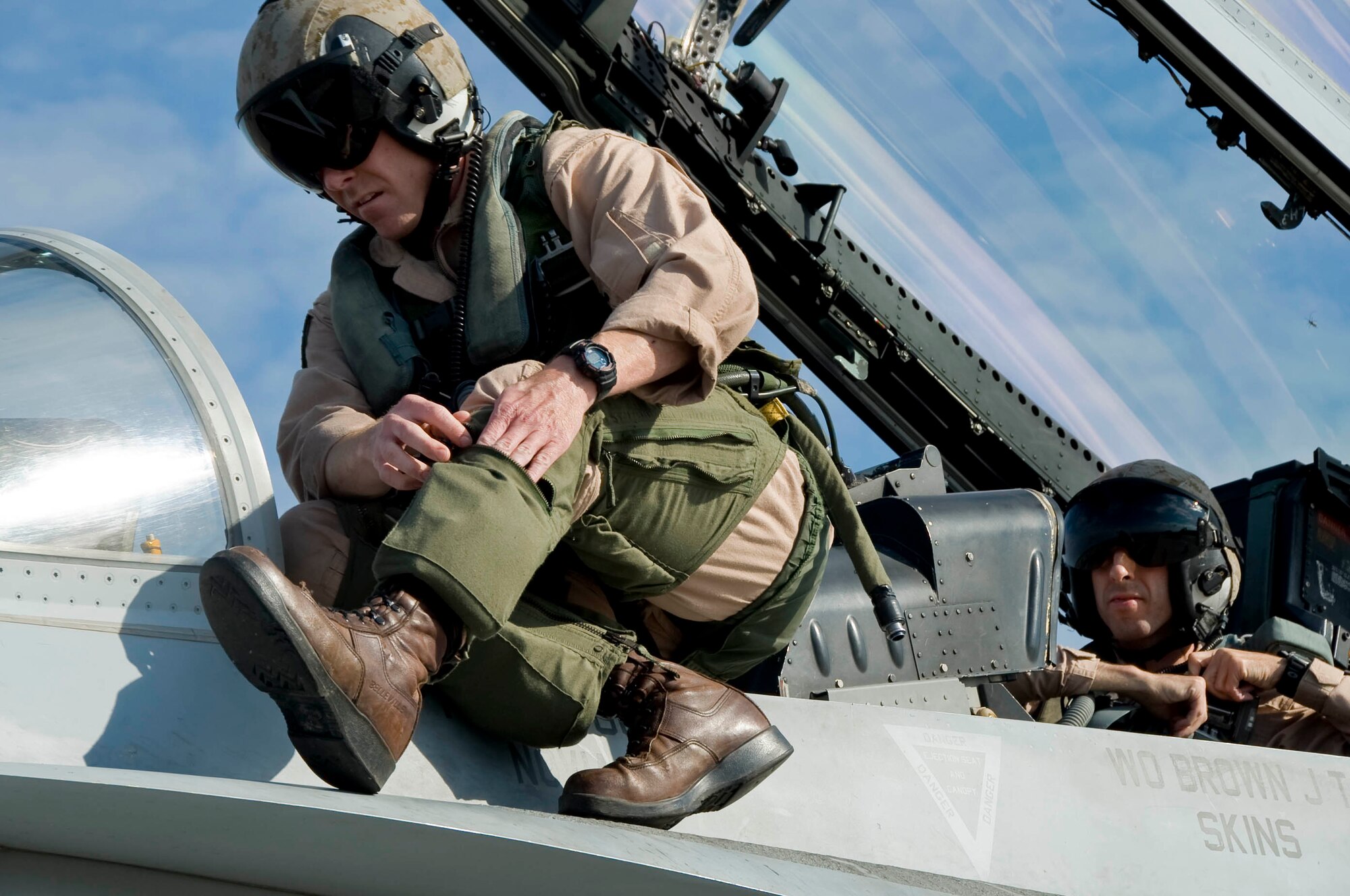 EIELSON AIR FORCE BASE, Alaska --Capt. Bryan Youngers from Miramar Naval Air Station adjusts his flight equipment prior to takeoff June 19, 2008. Captain Youngers is participating in RED FLAG- Alaska Alaska 08-3 a series of Pacific Air Forces commander-directed field training exercises for U.S. forces, provides joint offensive counter-air, interdiction, close air support, and large force employment training in a simulated combat environment.  (U.S. Air Force photo by Airman 1st Class Christopher Griffin)