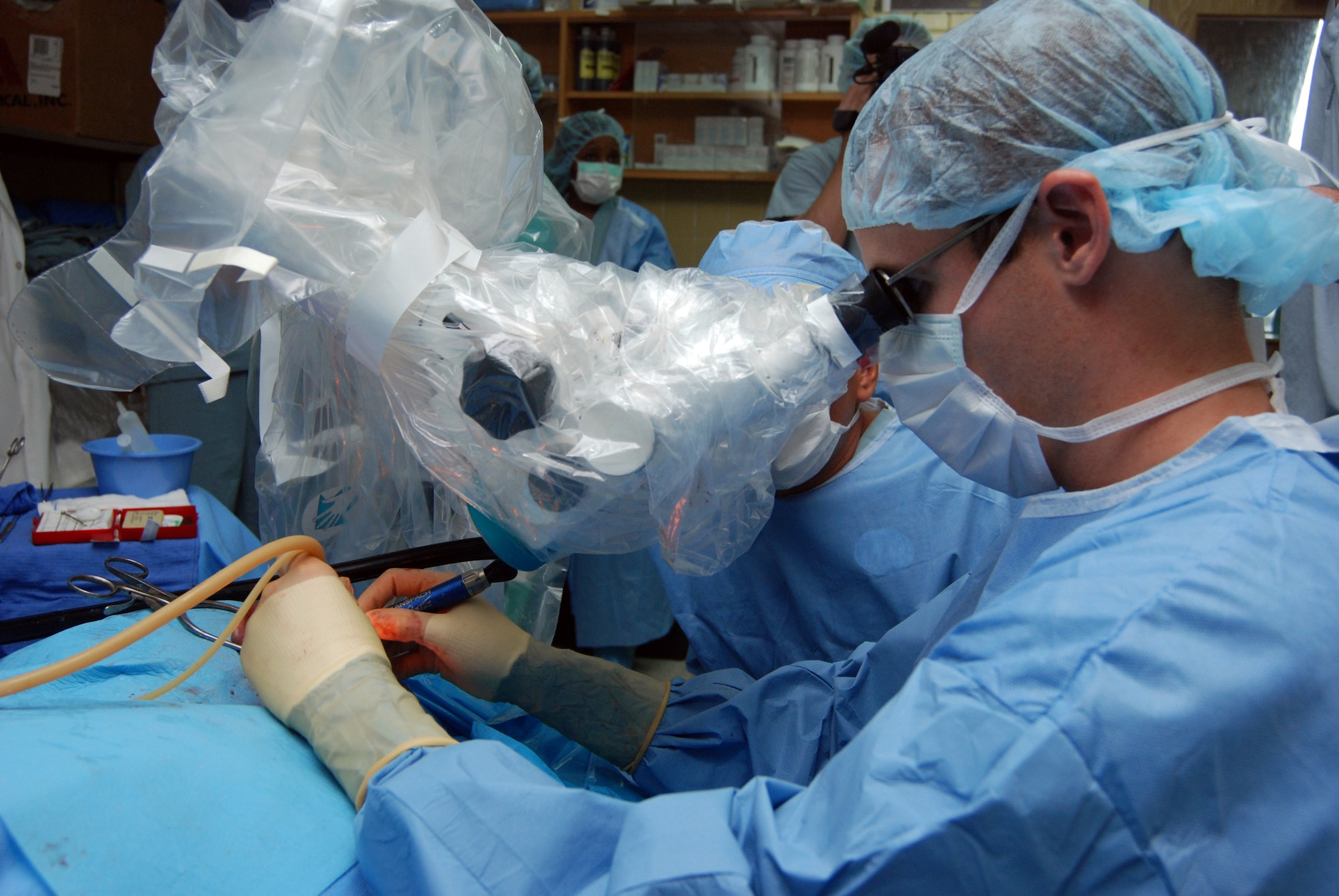 Capt. (Dr.) Luke Arnholt performs ear surgery on a patient June 17 at Hospital Escuela in Tegucigalpa, Honduras. A 14-person team from Wilford Hall Medical Center in San Antonio, Texas, did more than 240 patient evaluations and more than 40 surgeries during a two-week readiness training mission to the hospital. Captain Arnholt is an ear, nose and throat surgeon at WHMC. (U.S. Air Force photo/Tech. Sgt. John Asselin) 