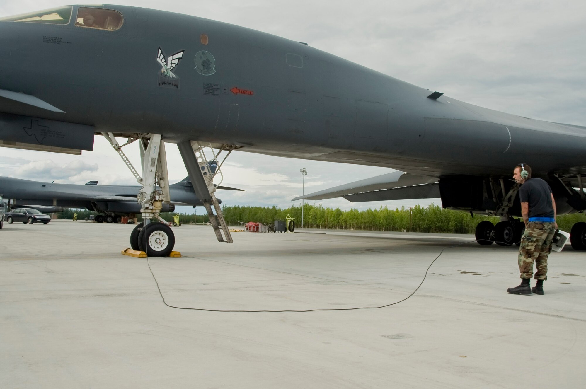 EIELSON AIR FORCE BASE, Alaska --A crew chief from Dyess Air Force Base goes through a pre-flight inspection for a B-1 Lancer during RED FLAG-Alaska 08-3 June 18, 2008. The B-1 Lancer is a supersonic strategic bomber with variable-sweep wings. The B-1's from Dyess are participating in RF-A 08-3, a series of Pacific Air Forces commander-directed field training exercises for U.S. forces, provides joint offensive counter-air, interdiction, close air support, and large force employment training in a simulated combat environment.  (U.S. Air Force photo by Airman 1st Class Christopher Griffin)