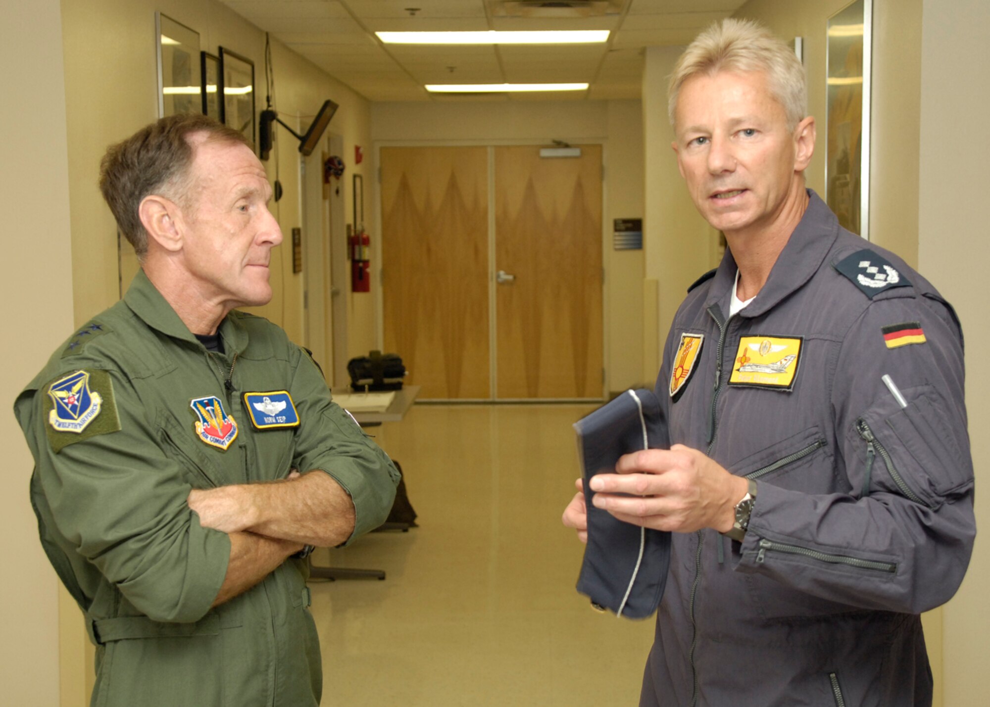 Lt. Gen. Norman R. Seip,12th Air Force commander, speaks with Col. Peter Klement (German Air Force Flying Training Center commander) during his visit to Holloman AFB, N.M., June 17. General Seip was given the opportunity to go through there Tornado simulator training. (U.S. Air Force photo/Airman 1st Class Michael Means)