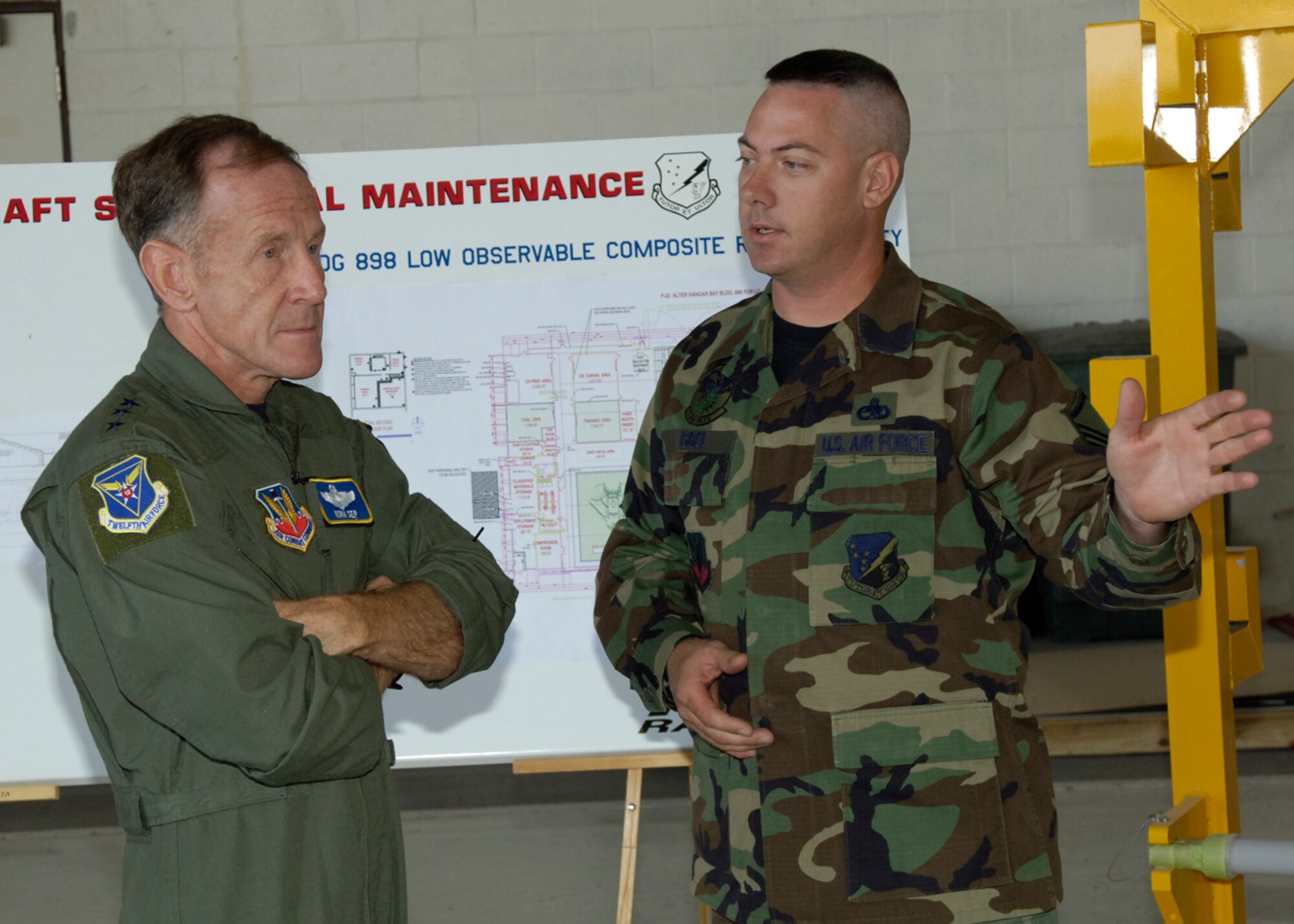 Lt. Gen. Norman R. Seip,12th Air Force commander, speaks with Master Sgt. Vernon Isbel, 49th Maintenance Squadron during his visit to Holloman AFB, NM, June 17. Holloman is the first base under General Seip's command to receive the F-22A Raptor. (U.S. Air Force photo/Airman 1st Class Michael Means)