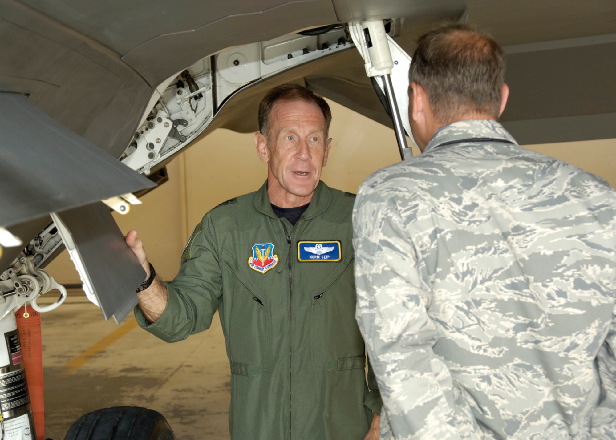 Lt. Gen. Norman R. Seip,12th Air Force commander, takes a look at the F-22A with Senior Master Sgt. Neal Raben, 49th Aircraft Maintenance Squadron, during his visit to Holloman AFB, N.M., June 17. Holloman is the first base under General Seip's command to receive the F-22A Raptor. (U.S. Air Force photo/Airman 1st Class Michael Means)