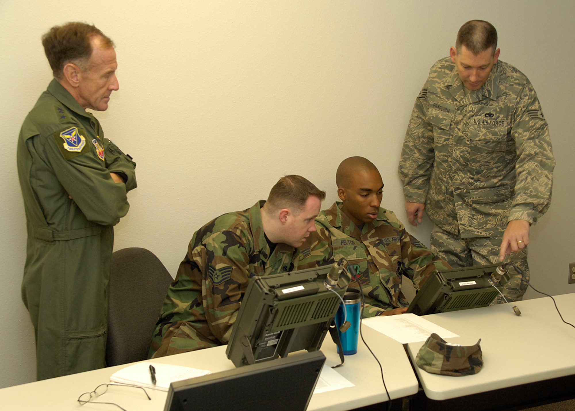 Lt. Gen. Norman R. Seip,12th Air Force commander, watches as Staff Sgt. Albert Fraelich, 372 Training Squadron Detachment 10 Avionics Instructor, teaches students from Holloman AFB, N.M., about the F-22A Raptor June 17. Holloman is the first base under General Seip's command to receive the F-22A Raptor. (U.S. Air Force photo/Airman 1st Class Michael Means)