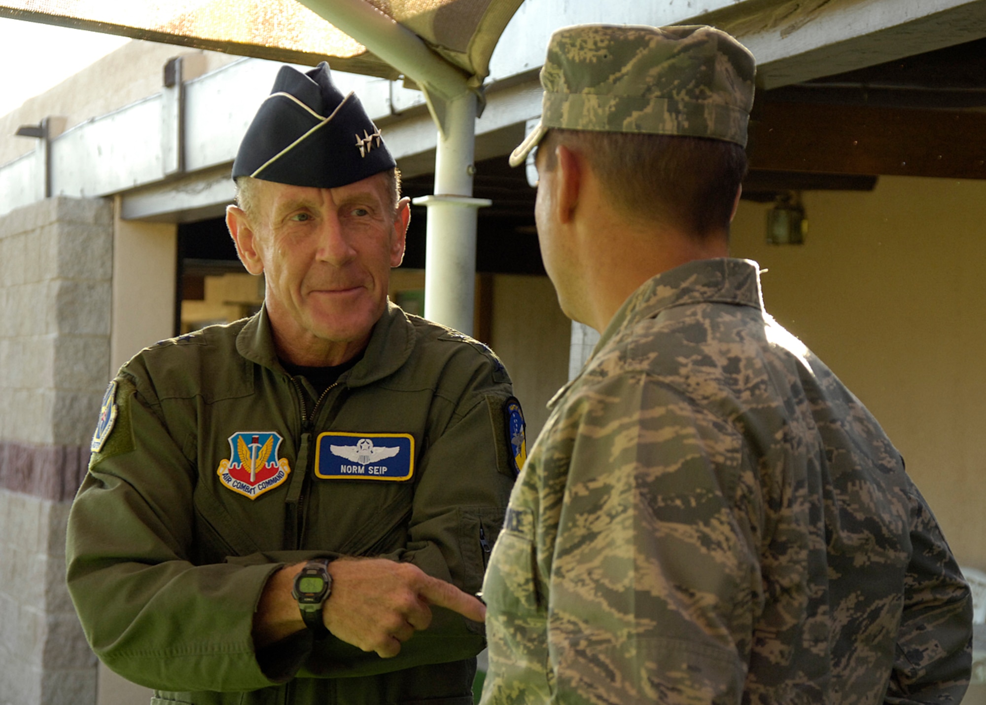 Lt. Gen. Norman R. Seip,12th Air Force commander, speaks with Col. Jeff Harrigian, 49th Fighter Wing commander during his visit to Holloman AFB, N.M., June 17. Holloman is the first base under General Seip's command to receive the F-22A Raptor.(U.S. Air Force photo/Airman 1st Class Michael Means)