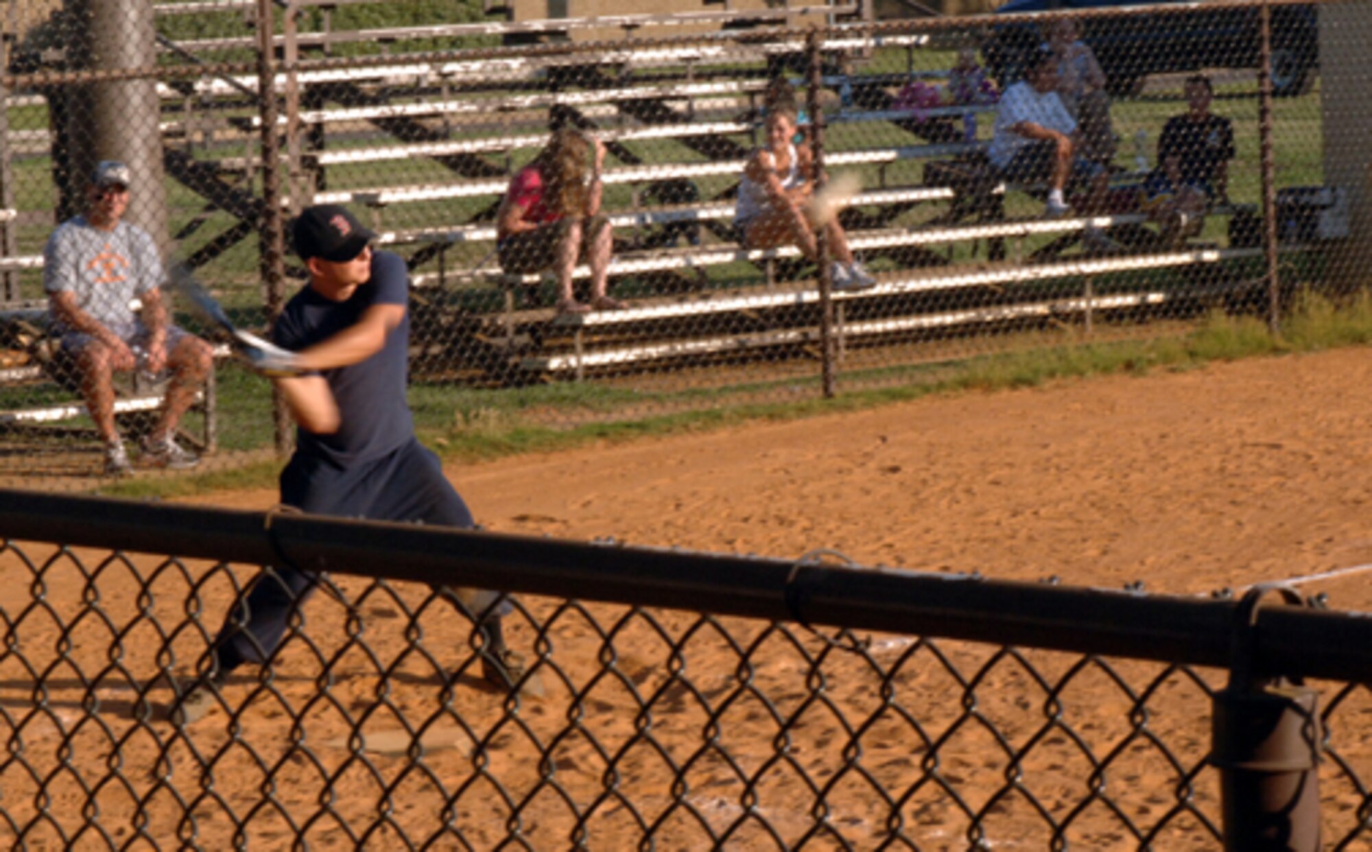 James Haitz, 14th Civil Engineer Squadron, swings at a pitch during intramural softball action June 19 in a game against the 14th Security Forces Squadron. The 14th CES defeated the 14th SFS with a score of 12 to 11. The next softball game is scheduled to be held July 1 next to Freedom Park. (U.S. Air Force photo by Airman Josh Harbin)