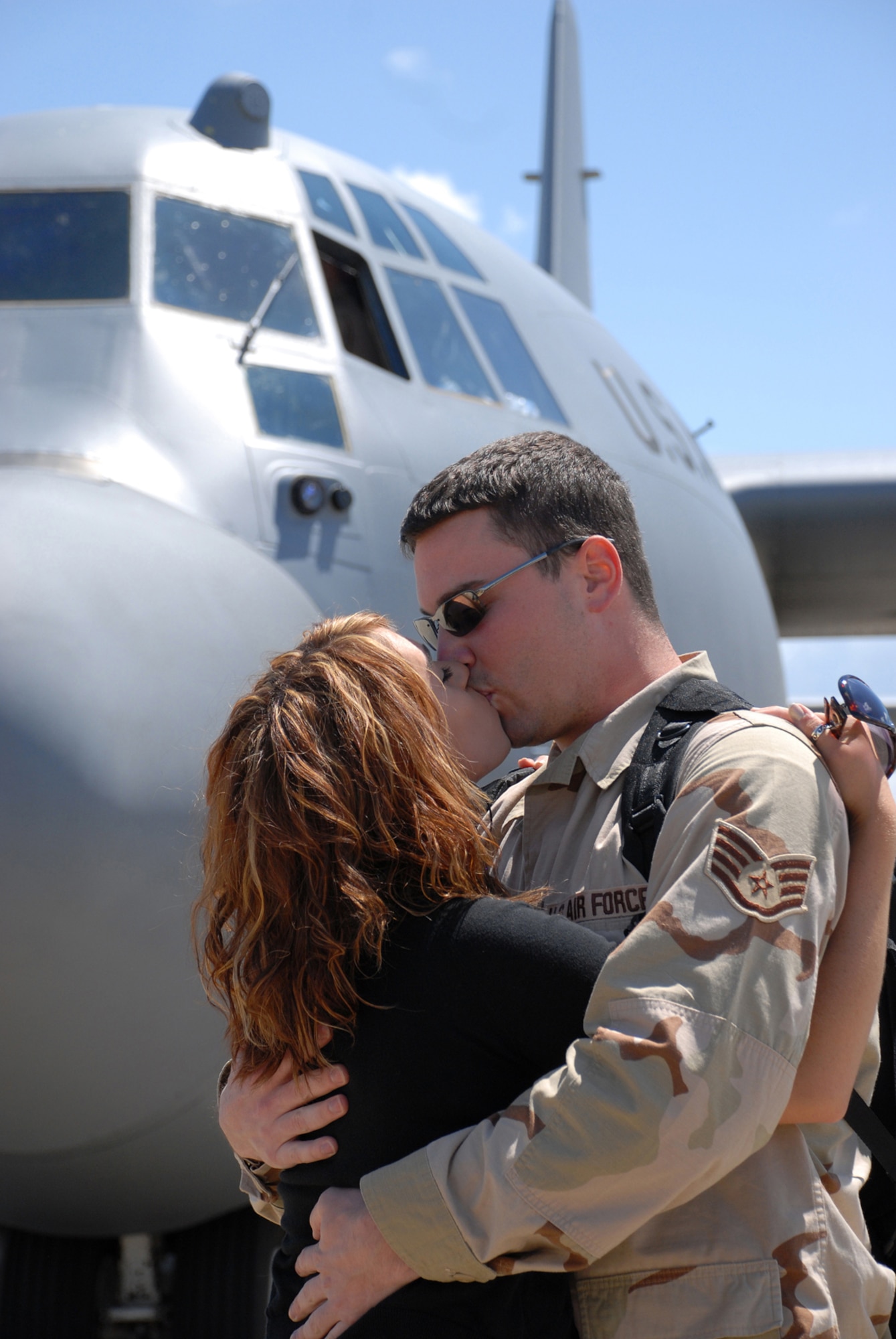NIAGARA FALLS AIR RESERVE STATION, N.Y. - Staff Sgt. John Worden, 914th Maintenance Squadron, gets a big hug and kiss from a loved one upon his return from the AOR.  Operations and maintenance personnel from the 914th Airlift Wing returned home after a two month deployment to Southwest Asia in support of Operations Iraqi Freedom and Enduring Freedom.  (U.S. Air Force photo / Master Sgt. Peter Borys)