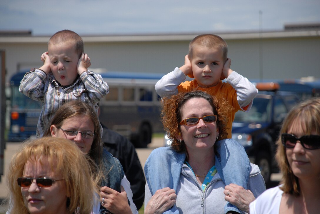 NIAGARA FALLS AIR RESERVE STATION, N.Y. - The noise from the C-130H aircraft is just a little too loud for these youngsters as they and other family members await the return of their loved ones from the AOR.   914th maintenance and aircrew personnel completed a two month deployment to Southwest Asia in support of Operations Iraqi Freedom and Enduring Freedom.  (U.S. Air Force photo / Master Sgt. Peter Borys)