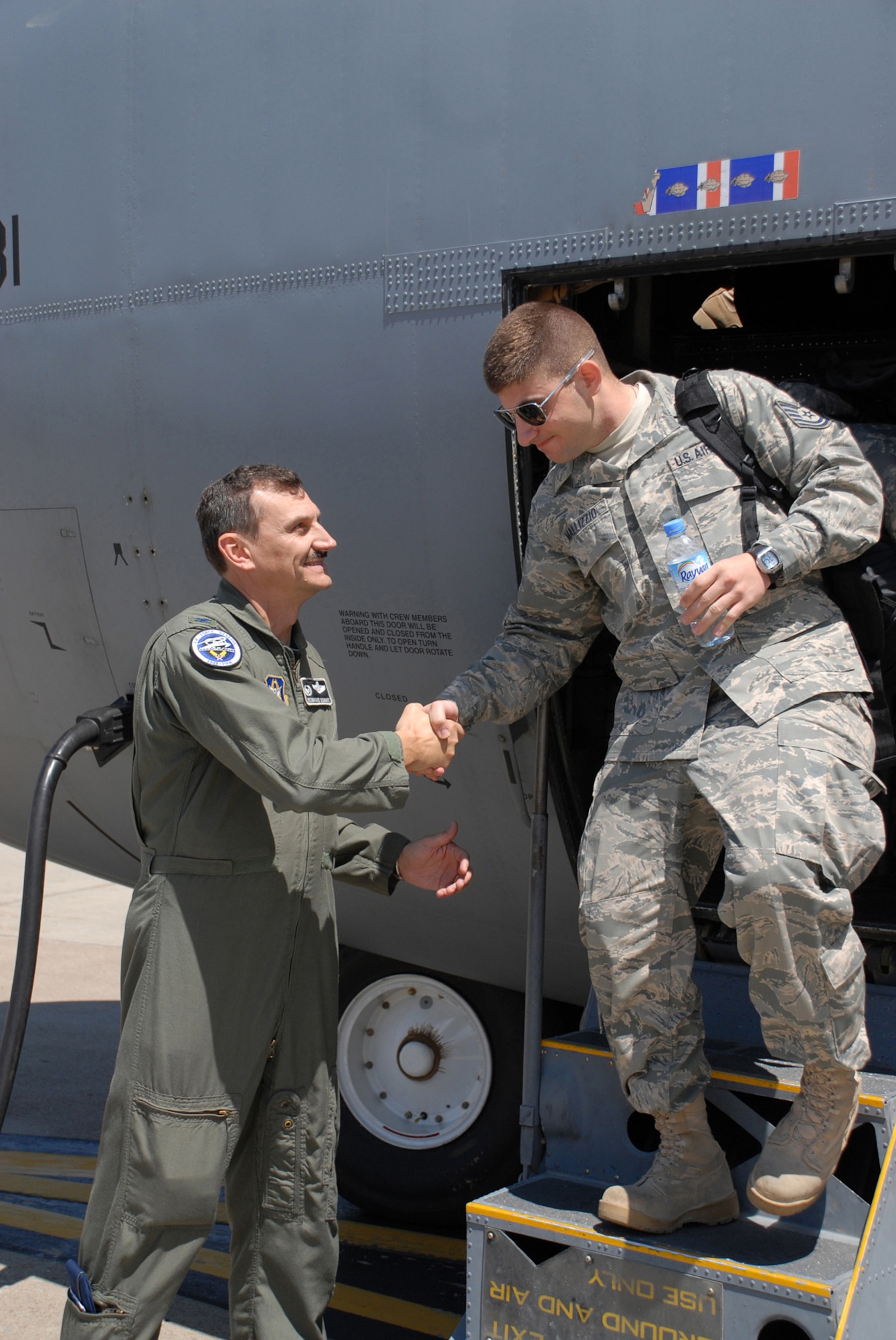 NIAGARA FALLS AIR RESERVE STATION, N.Y. - Col. Reinhard Schmidt, 914th Airlift Wing Commander, welcomes home Tech. Sgt. Anthony Mallizzio, 914th Maintenance Operations Flight, after a two month deployment in the AOR.  Niagara aircrew and maintenance personnel were deployed to Southwest Asia in support of Operations Iraqi Freedom and Enduring Freedom.  (U.S. Air Force photo / Master Sgt. Peter Borys)