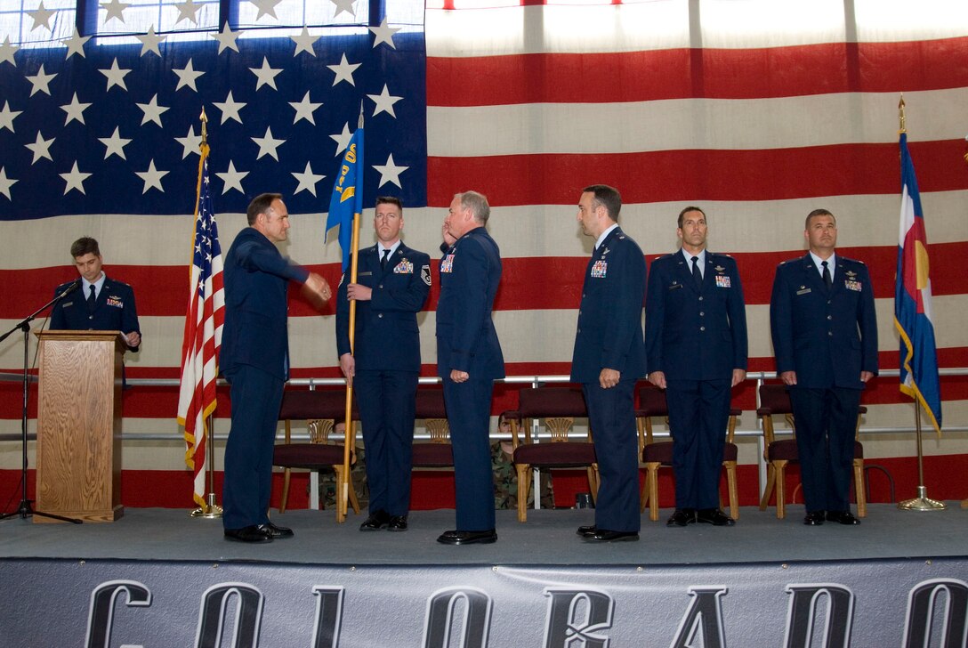 Lt. Col. Brian "TA" Patterso relinquishes command of the 140th Operational Support Squadron to Brig Gen. Trulan A. Eyre, 140th Wing Commander.