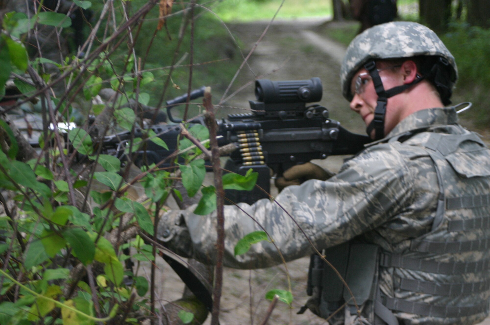 Airman 1st Class Tyler Mollenhauer, 60th Security Forces Squadron, Travis AFB, Calif., performs security during Combat First Aid Training June 19 at Fort Dix, N.J. The class was part of Phoenix Warrior Training 08-5; pre-deployment training for security forces members. (U.S. Air Force photo/Airman 1st Class Rebekah Phy)