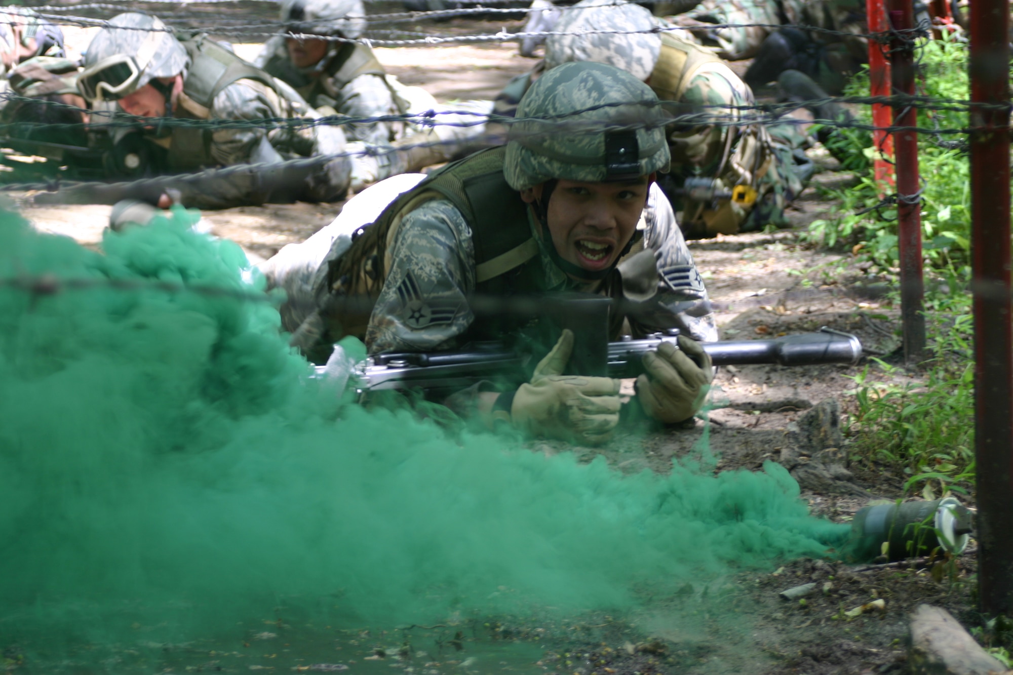 Senior Airman My Tran, 30th Security Forces Squadron, Vandenberg AFB, Calif., low crawls through heavy smoke during Phoenix Warrior Training 08-5 June 19 at Fort Dix, N.J. The class, Combat First Aid Training, was held during day three of the 10-day course. Specifically designed for security forces members, the course is used as pre-deployment training. (U.S. Air Force photo/Airman 1st Class Rebekah Phy)