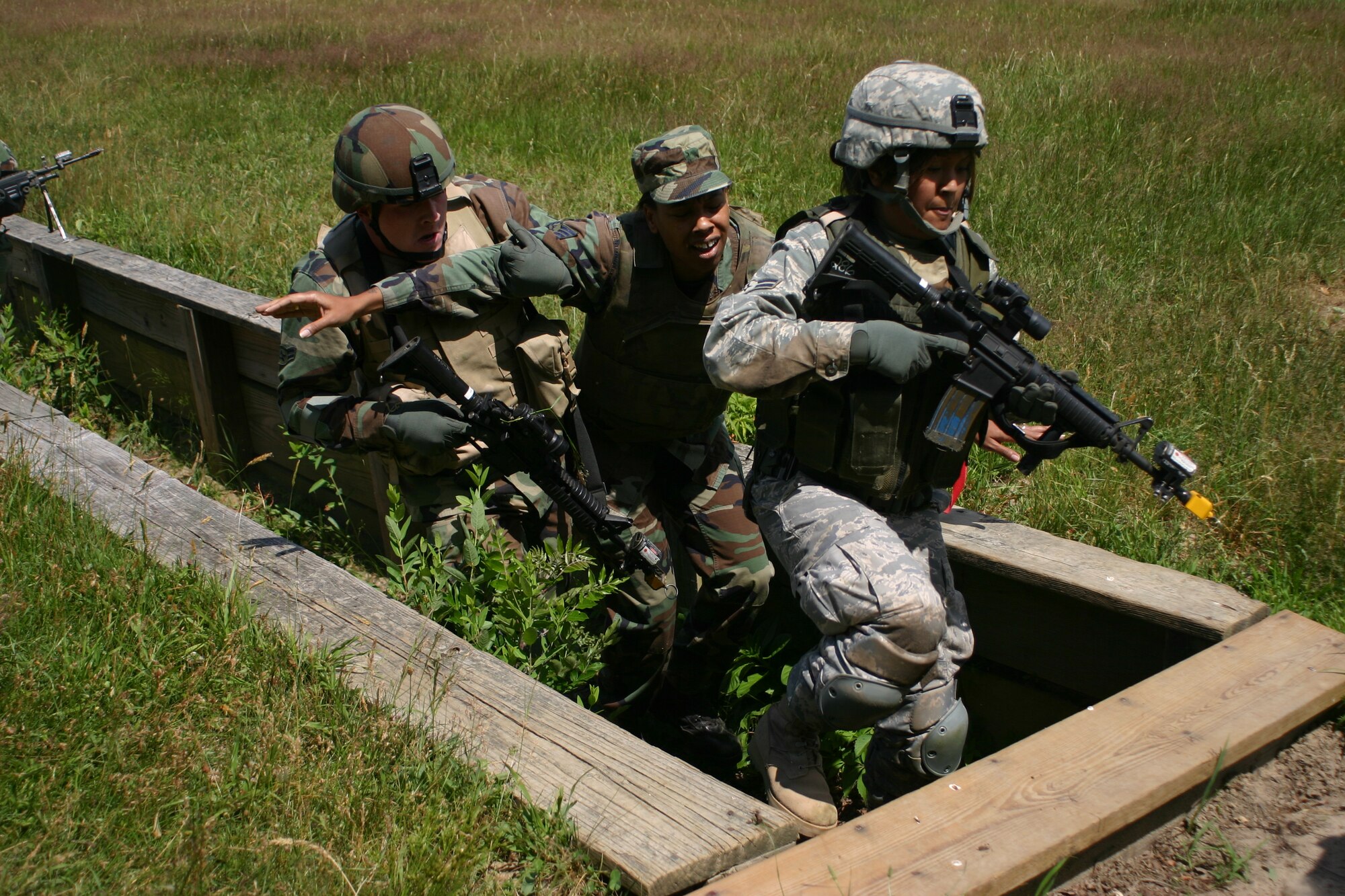 Members from the 30th Security Forces Squadron, Vandenberg AFB, Calif., transport a victim during Combat First Aid Training as part of Phoenix Warrior Training 08-5 June 19 at Fort Dix, N.J. The course is designed as pre-deployment training for security forces Airmen. (U.S. Air Force photo/Airman 1st Class Rebekah Phy)