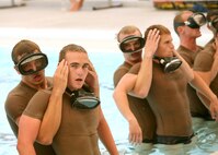 6/17/2008 - Students in the pararescue indoctrination course at the Lackland Training Annex recover after completing a 40-meter underwater swim June 17. The 10-week course trains future PJs through intense physical and mental training.  Only the best of the best will make it - the drop-out rate during the initial ten-week pararescue indoctrination course is typically sixty to seventy percent.
(USAF photo by Robbin Cresswell)