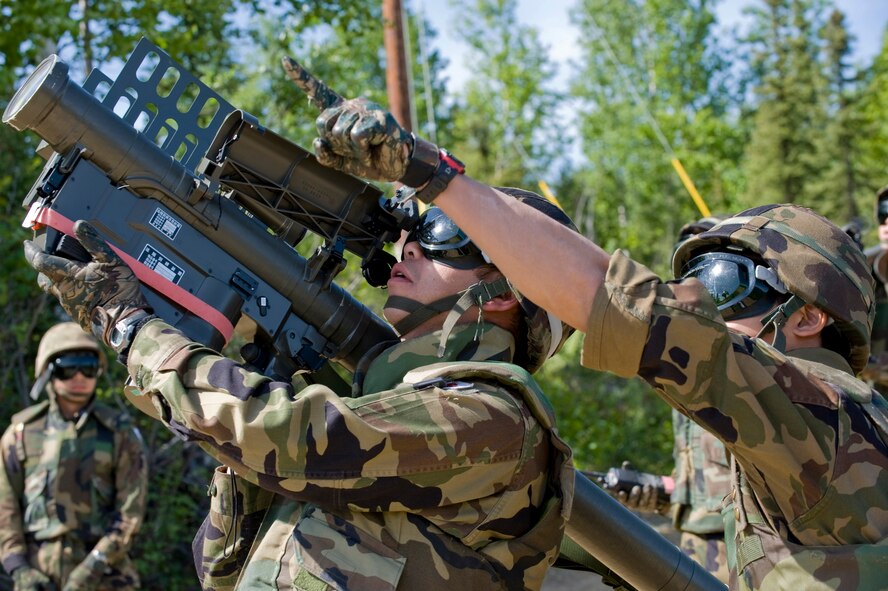 Staff Sgt. Masayuki Inomata aims a surface-to-air missile launcher at "enemy aircraft" June 11 while Staff Sgt. Hiroshi Yamashita locates the target during the Red Flag-Alaska. Both are missile operators assigned to the Japanese Air Self Defense Force. (U.S. Air Force photo/Airman 1st Class Jonathan Snyder) 