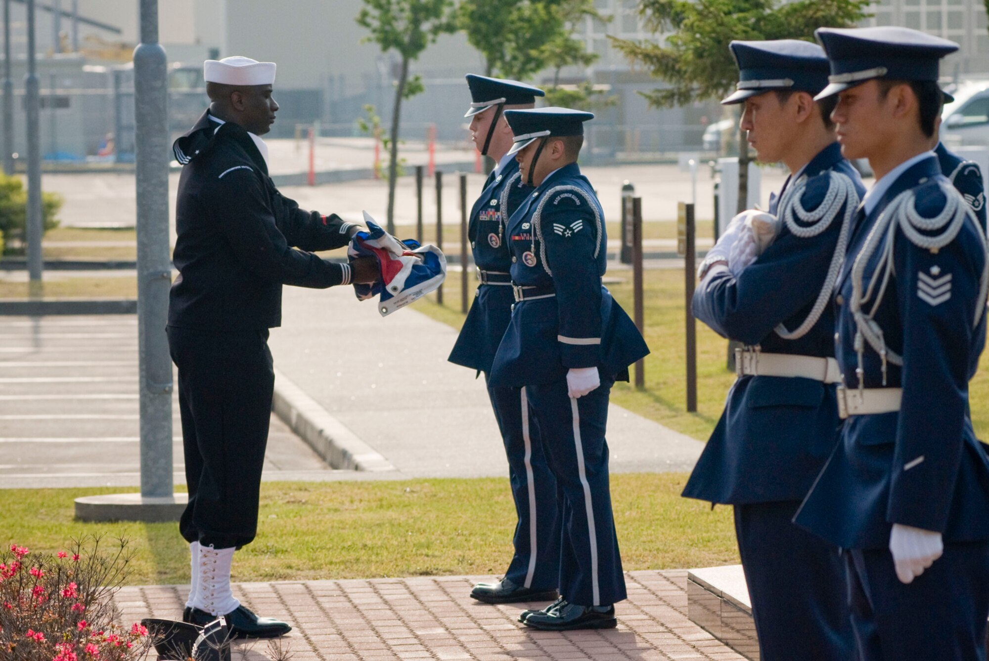 MISAWA AIR BASE, Japan -- The American and Japanese flags are folded during a Memorial Day Retreat ceremony May 22, 2008.  The retreat ceremony was a joint endeavor by the Misawa Honor Guard and the Japan Air Self-Defense Force Security Flight.  (U.S. Air Force photo by Staff Sgt. Samuel Morse)