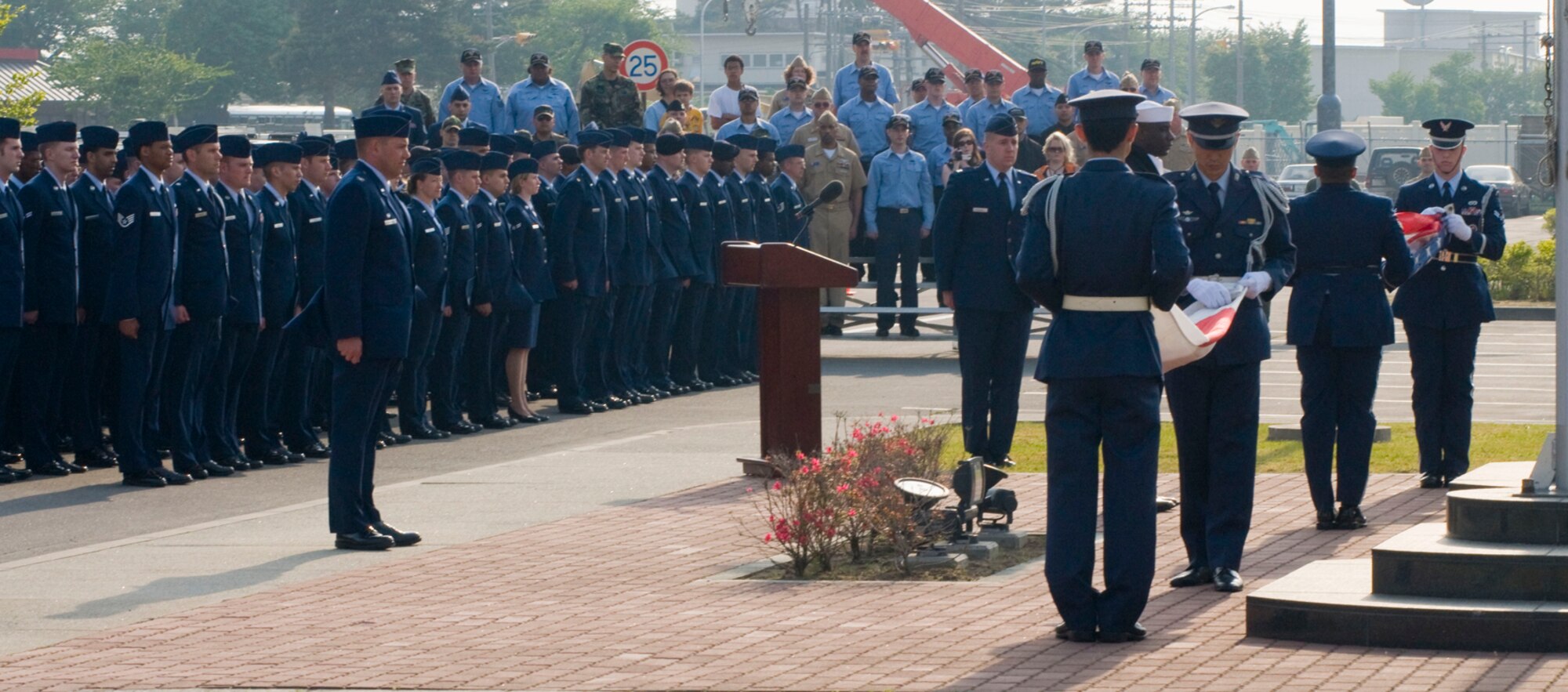 MISAWA AIR BASE, Japan -- The American and Japanese flags are folded during a Memorial Day Retreat ceremony May 22, 2008.  The retreat ceremony was a joint endeavor by the Misawa Honor Guard and the Japan Air Self-Defense Force Security Flight.  (U.S. Air Force photo by Staff Sgt. Samuel Morse)