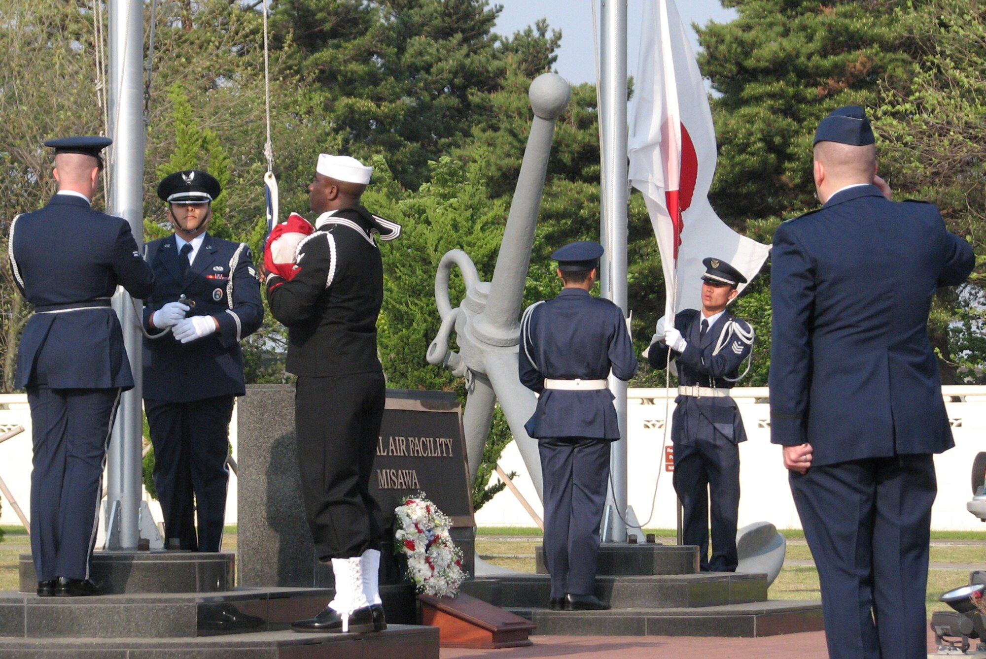 MISAWA AIR BASE, Japan -- The American and Japanese flags are lowered during a Memorial Day Retreat ceremony May 22, 2008.  The retreat ceremony was a joint endeavor by the Misawa Honor Guard and the Japan Air Self-Defense Force Security flight.  (Japan Air Self-Defense Force photo by Staff Sgt. Jun Ishida)