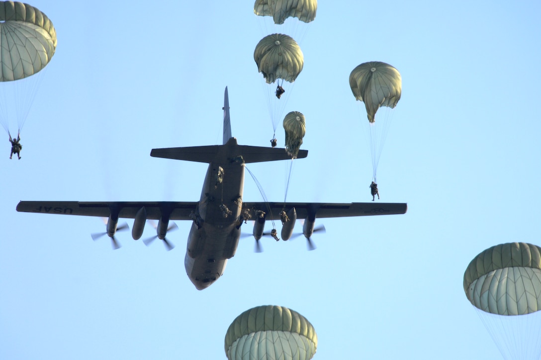 U.S. soldiers of the 305th Parachute Infantry Regiment, 82nd Airborne Division parachute out of a U.S. Air Force C-130 Hercules aircraft at night during a joint forcible entry exercise on Fort Bragg, N.C., June 17, 2008. 