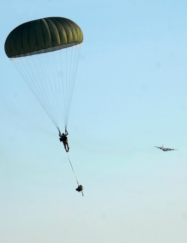 U.S. soldiers assigned to the 82nd Airborne Division, 505th Parachute Infantry Regiment parachute to the ground as an Air Force C-17 Globemaster III aircraft makes its descent during a joint forcible entry exercise on Fort Bragg, N.C., June 17, 2008. 