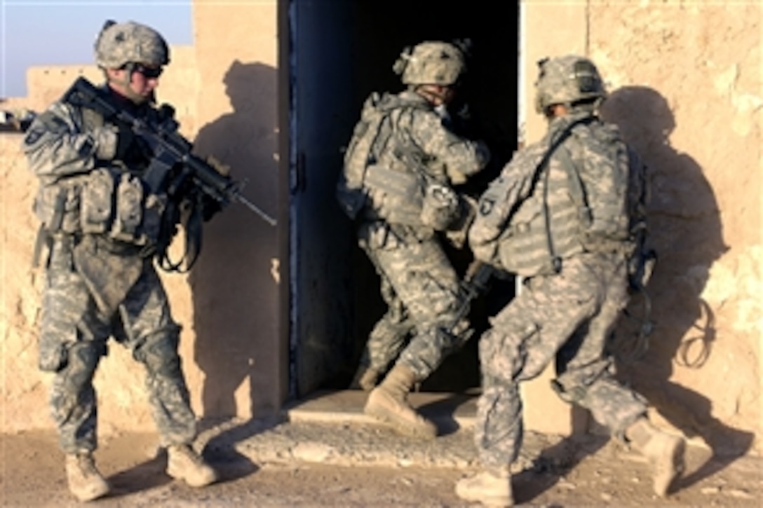 U.S. Army soldiers of the 101st Airborne Division conduct a cordon and search mission in Bayji, Iraq, June 17, 2008.