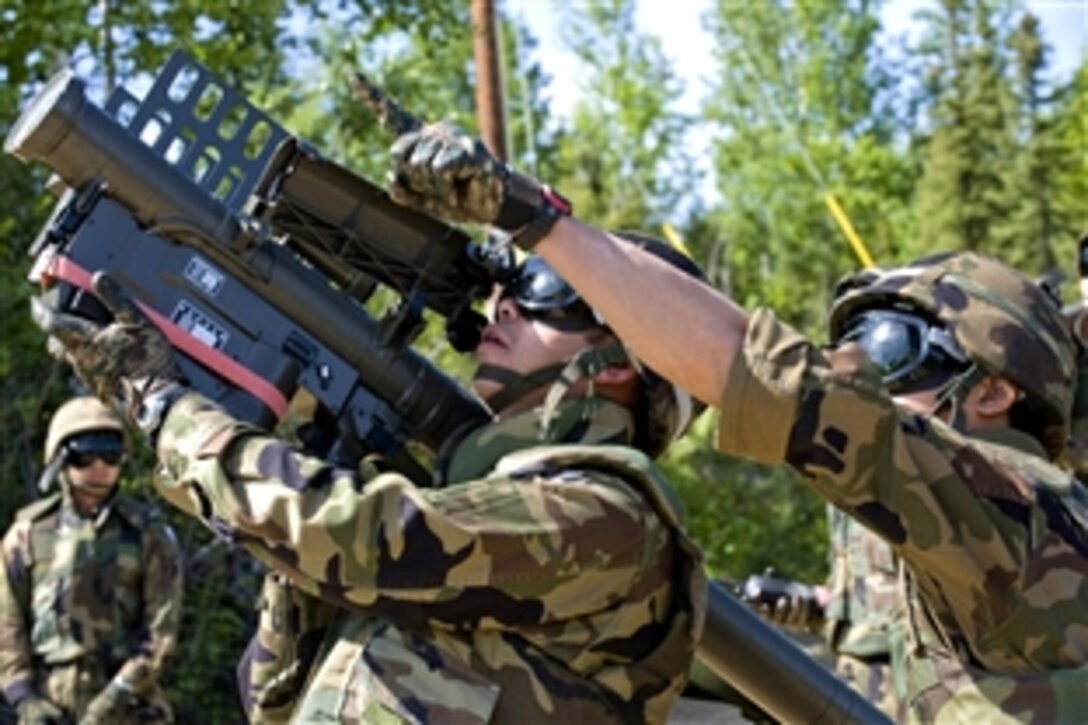 Japanese Army Staff Sgt. Masayuki Inomata aims a surface-to-air missile launcher at "enemy aircraft", June 11, 2008, while Staff Sgt. Hiroshi Yamashita locates the target during Exercise Red Flag-Alaska. Both are missile operators assigned to the Japanese Air Self Defense Force. Red Flag-Alaska is a Pacific Air Forces-sponsored 10-day combat training exercise conducted four times a year on  Eielson Air Force Base, Alaska.
