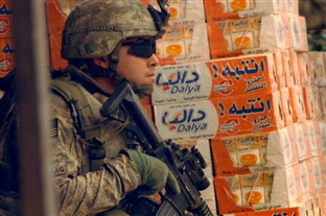 U.S. Army Capt. Eric Oksenvaag maintains a security position along in the Jamilla Market area of the Sadr City District of Baghdad, June 18, 2008. Oksenvaag commands the 1st Armored Division's Company C, Task Force Regulars, 1st Battalion, 6th Infantry Regiment, 2nd Brigade Combat Team, attached to 3rd Brigade Combat Team, 4th Infantry Division, Multi-National Division – Baghdad.